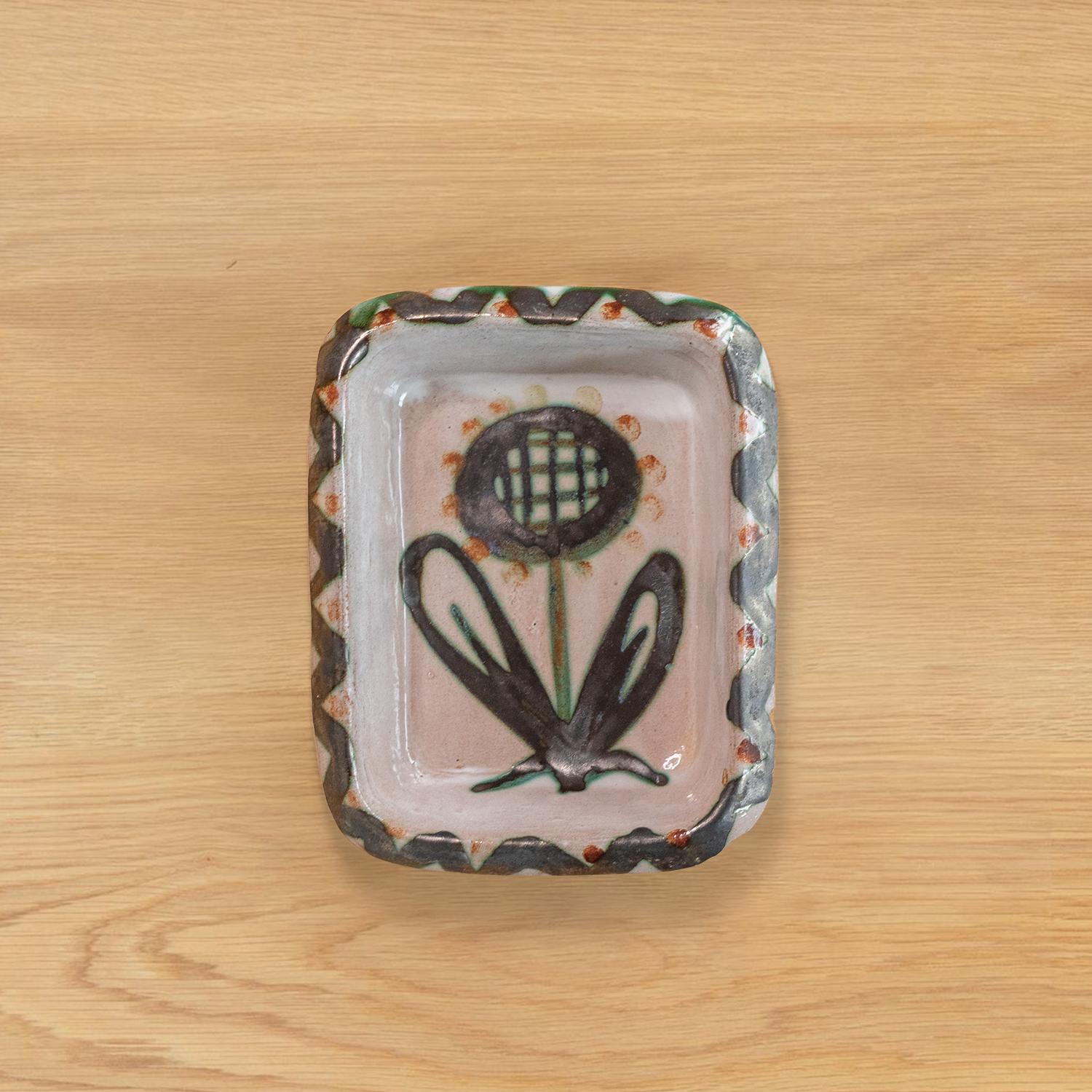 Beautiful painted ceramic dish by Robert Picault, France, 1950s. Rectangular dish with painted flower and green zig zag edge. Perfect as a catch-all or jewelry tray. Signed.