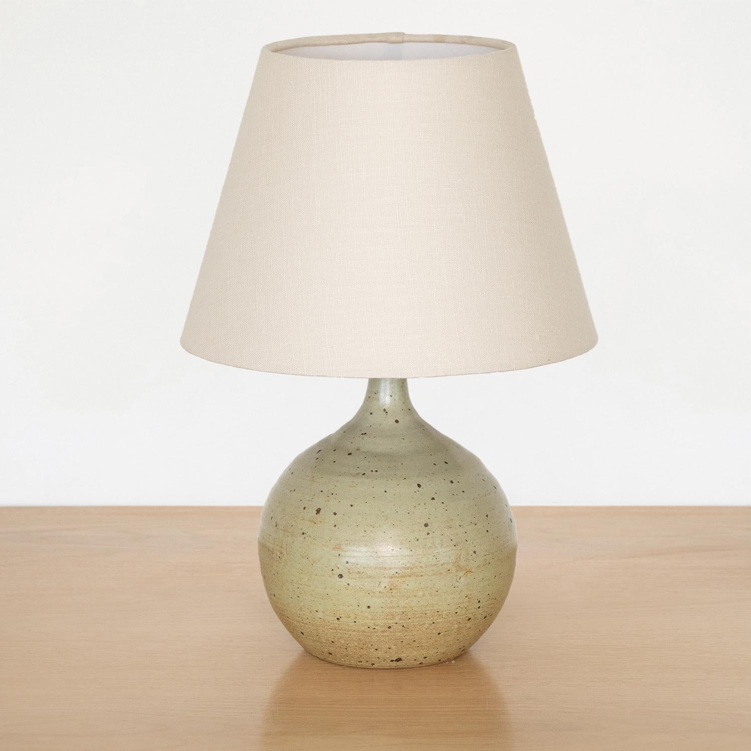 Vintage ceramic globe lamp from France, 1960s. Matte glazed ceramic base in neutral brown tones and speckled coloring. Newly rewired with new linen shade.