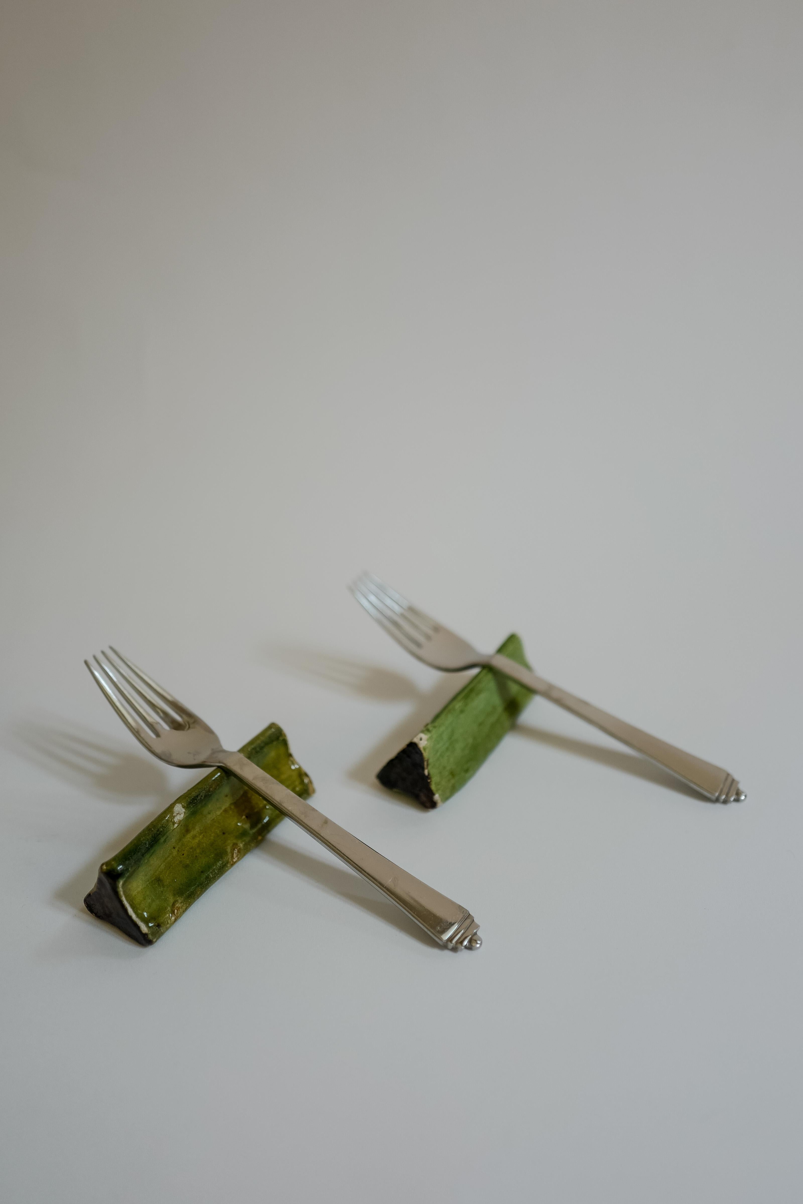Glazed French Ceramic Knife Rests in a Green Glaze Set of 10 For Sale