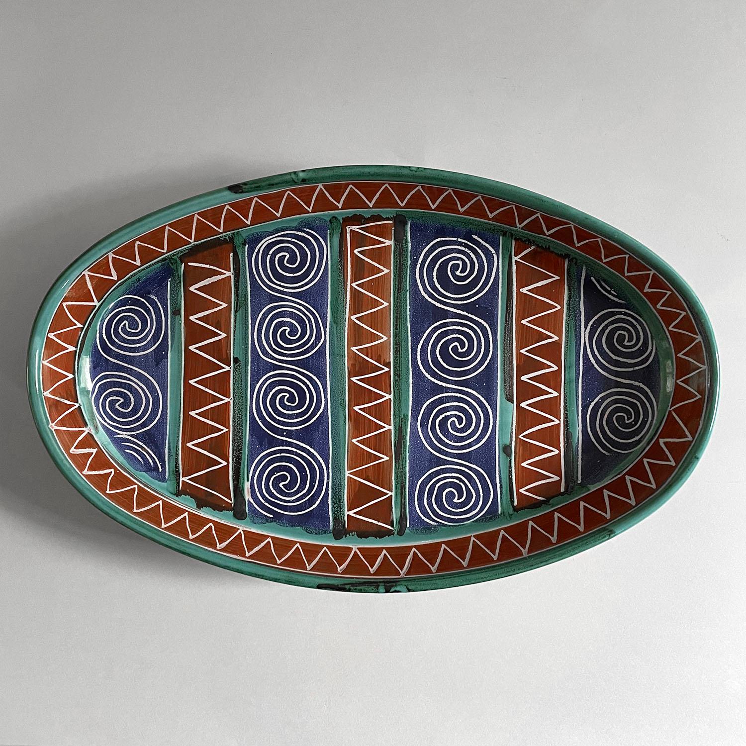 Robert Picault ceramic oval tray
France, circa 1950s
Brighten up your table with the perfection of Picault
handcrafted tray has a wonderful color palette and playful patterns
Patina from age and use
Marked identification
Last two photos are