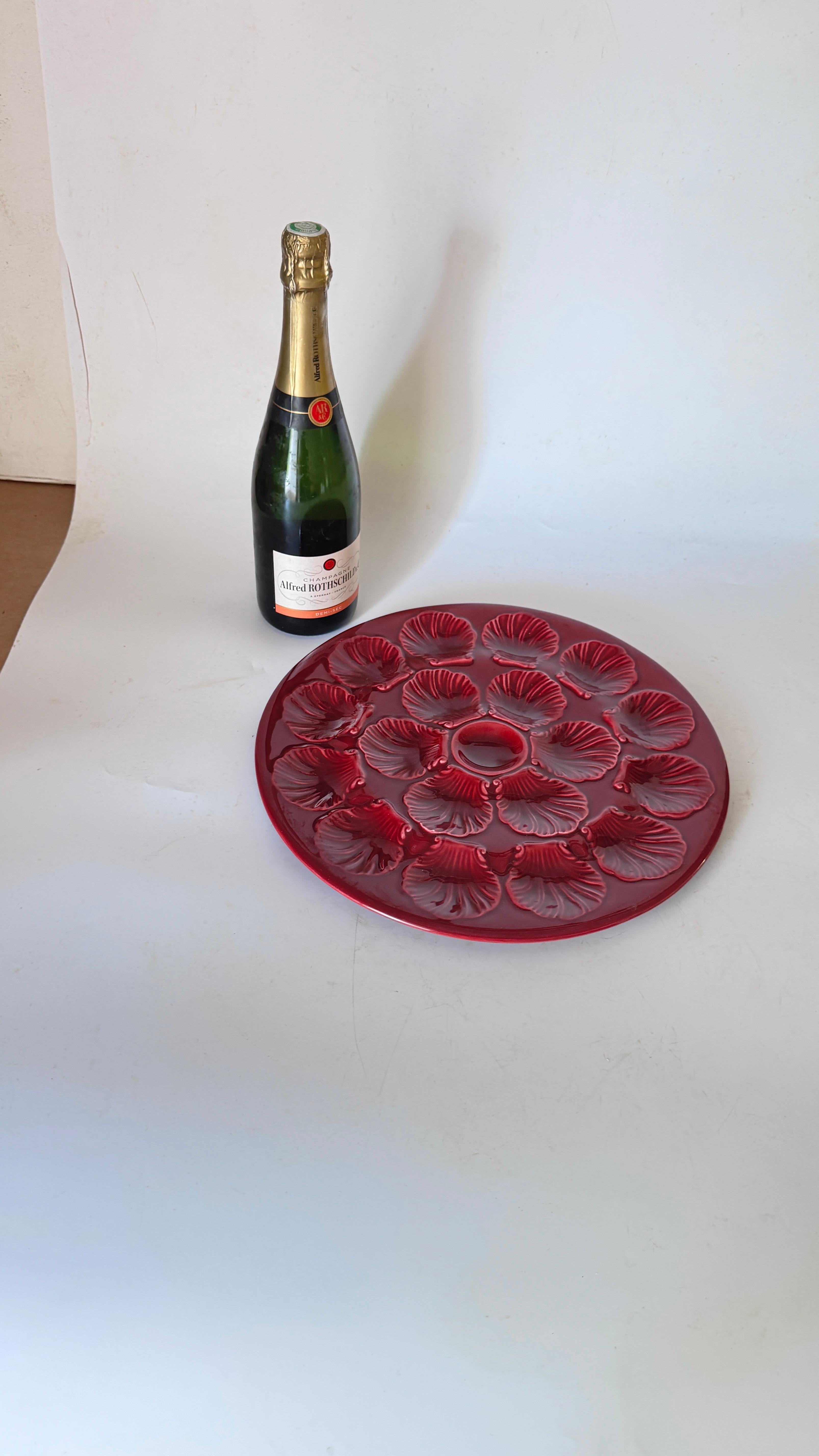 French Ceramic Oyster Plate – Deep Red Glaze – 1960s

Description:
This is a beautiful oyster plate made in France in the 1960s, crafted from ceramic with a deep red to purplish glaze that offers a striking and sophisticated appearance. The surface