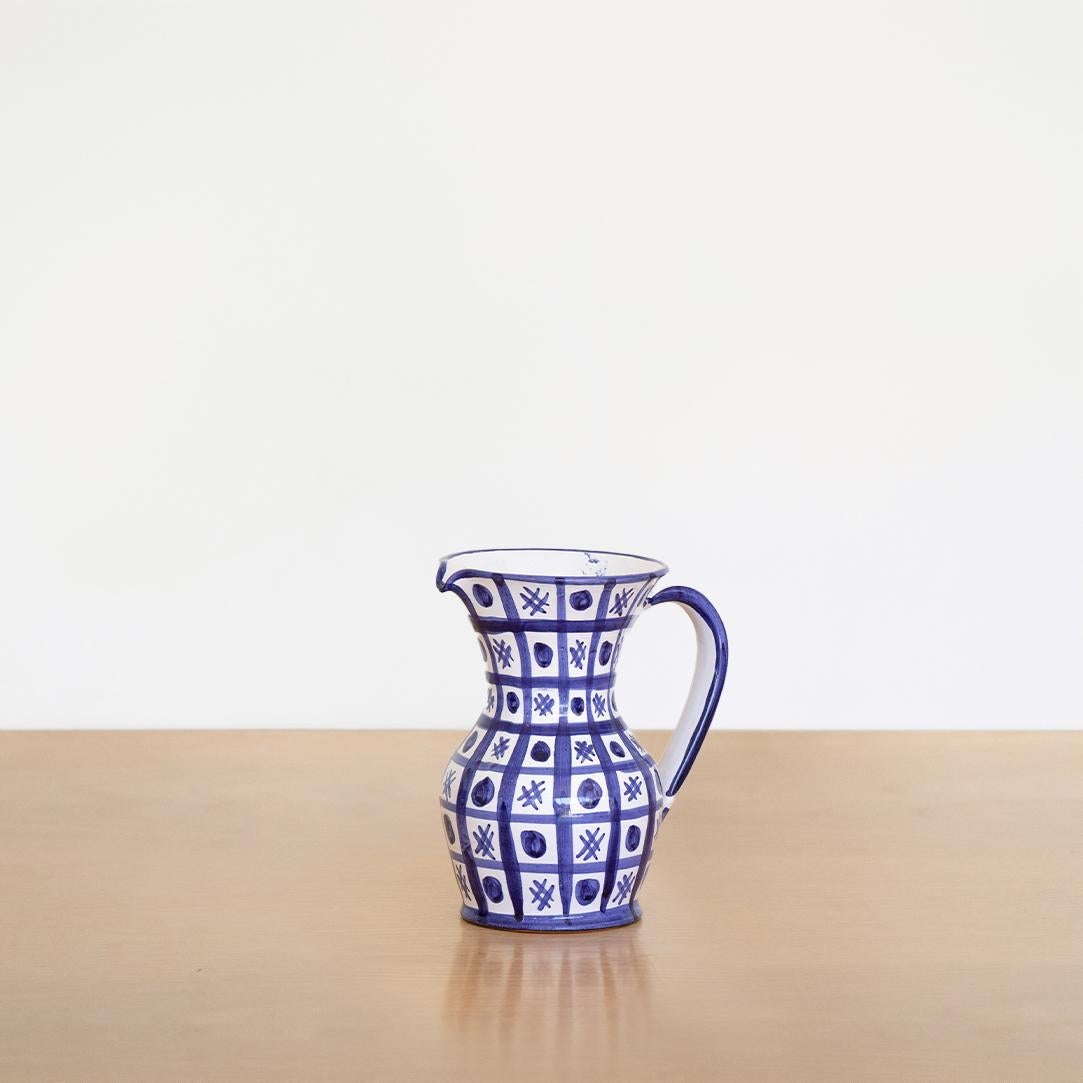 Beautiful painted ceramic pitcher from France by Robert Picault. Curved handle with white glazed ceramic and painted blue grid. Signed RP on bottom.
 
