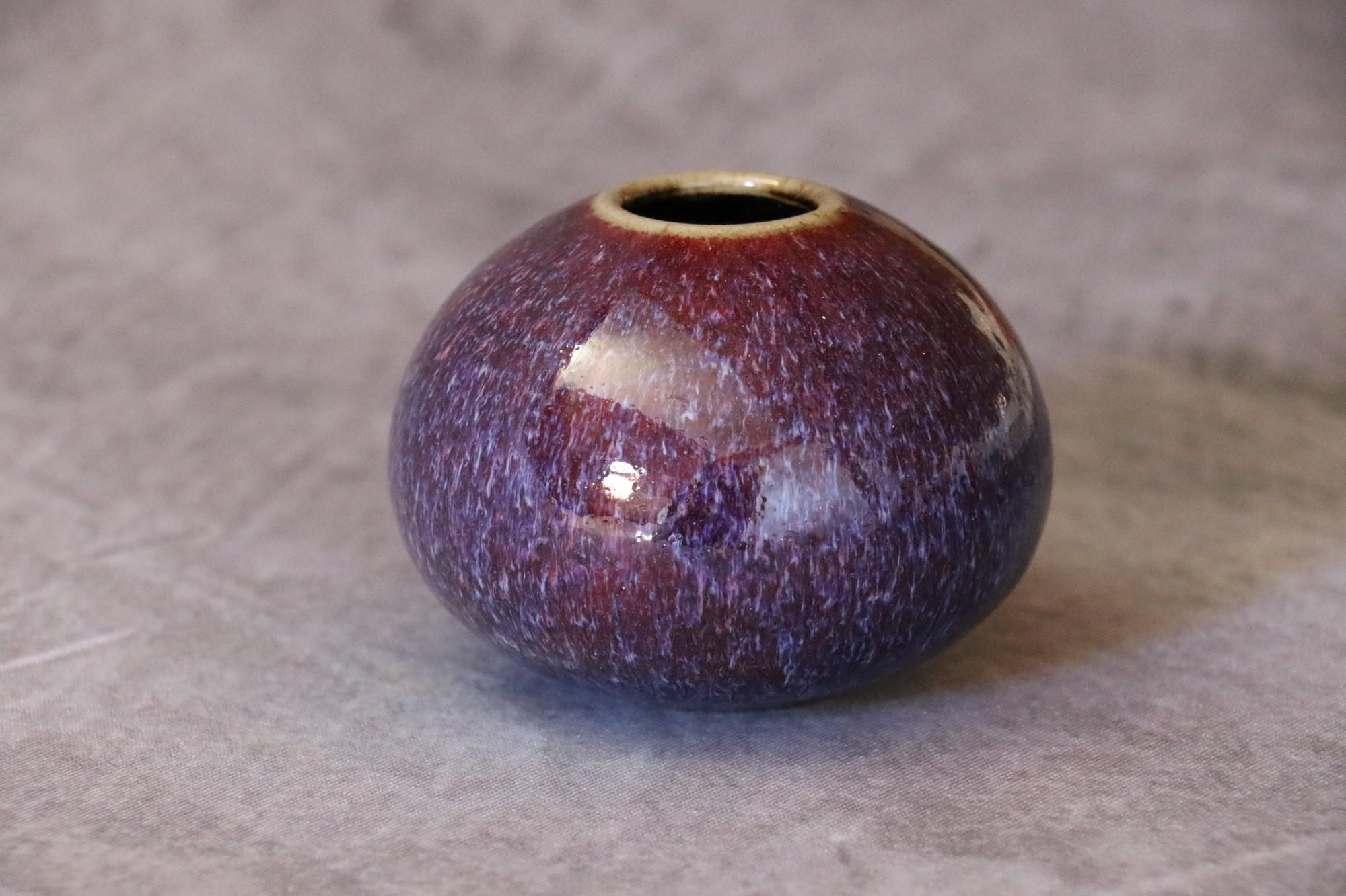 French ceramic ball vase by Marc Uzan - circa 2000
Delicate enamelling in shades of purple - Ring neck.
Signed under the base.
Very good condition.

--------------------------
Born in Sousse, Tunisia in 1955, Marc Uzan discovered modelling at