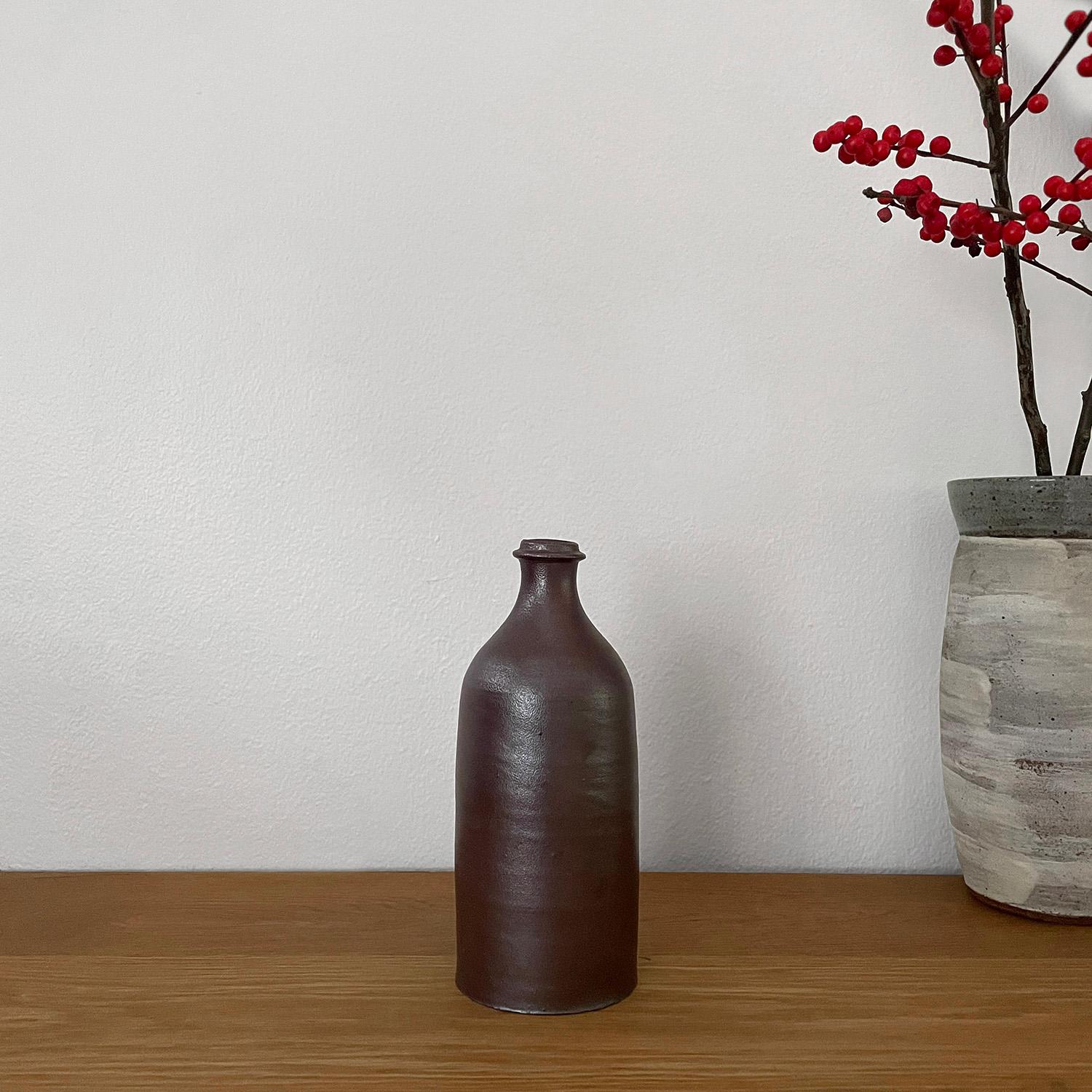 French stoneware bottle 
Neutral toned ceramic stoneware ceramic bottle 
Organic composition and feel
Vessel has not been tested to hold water
Patina from age and use
Last two photos are for reference only 
Please see other listings