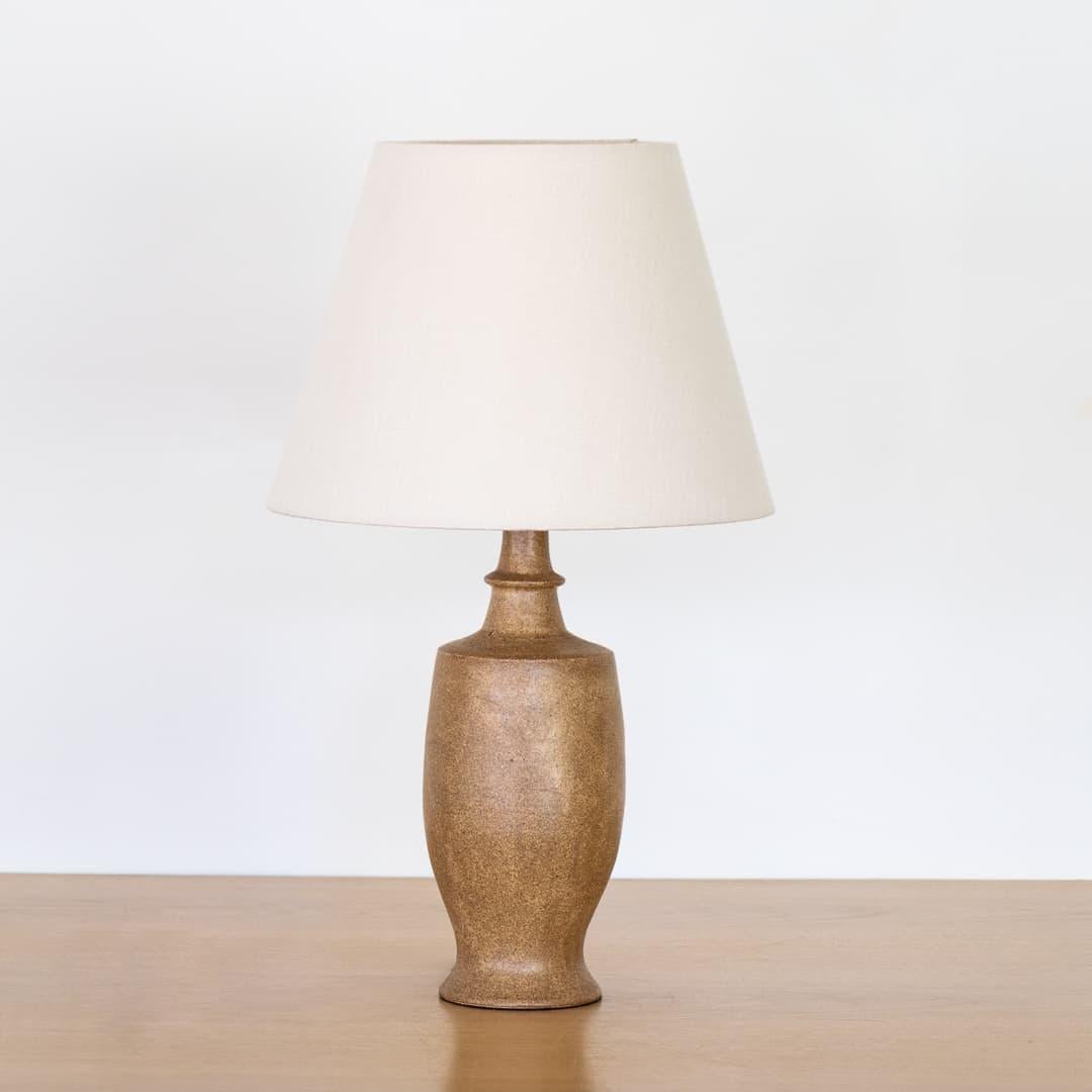 Beautiful vintage ceramic table lamp from France, 1960s. Matte glazed ceramic base in neutral brown tones. Newly rewired and new tapered linen shade with diffuser. Takes one E12 base bulb, 40 W or higher using LED.