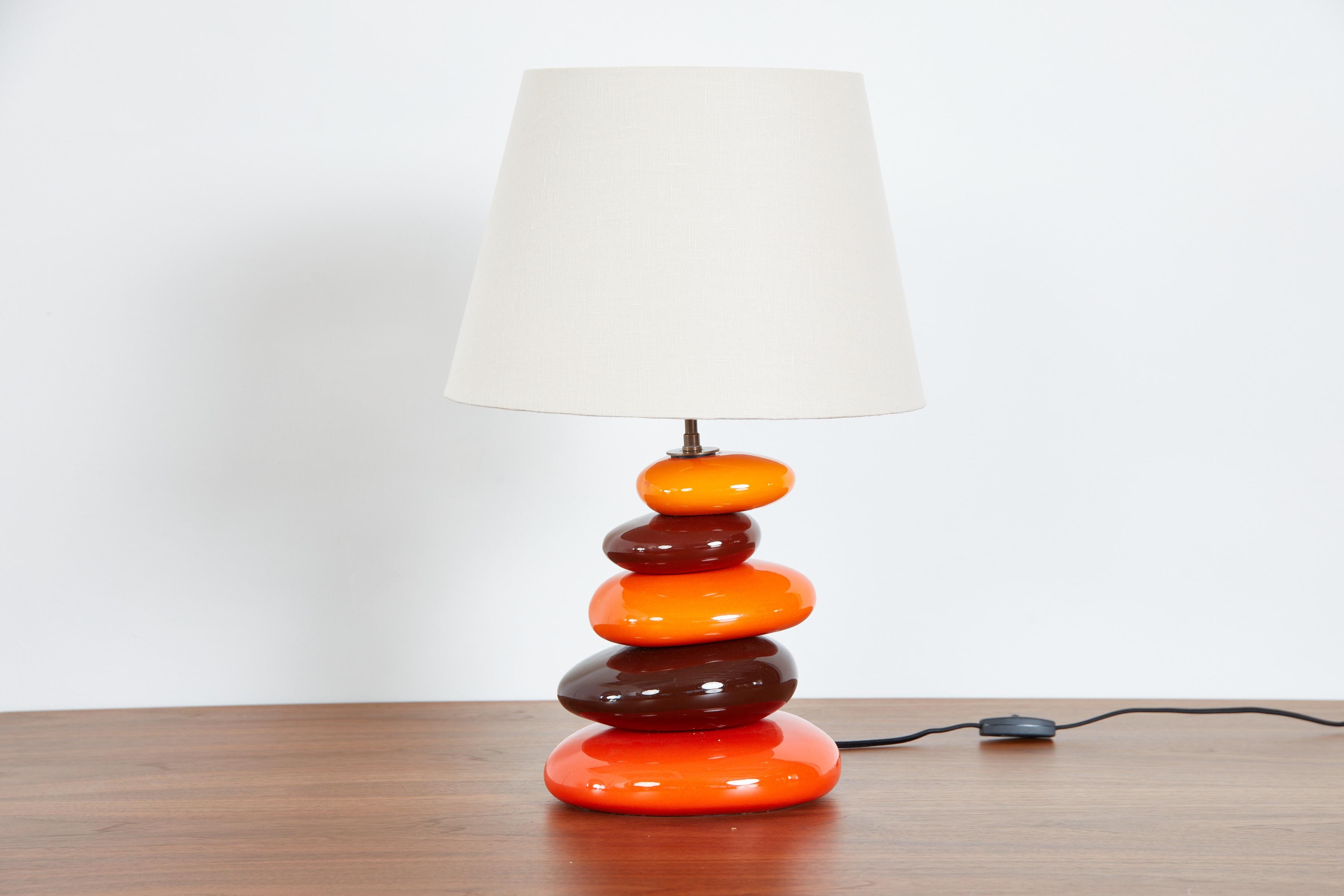 French colorful ceramic table lamp with colorful irregularly shaped stacked spheres. 
France, circa 1970s 
Newly rewired with new linen shade. 