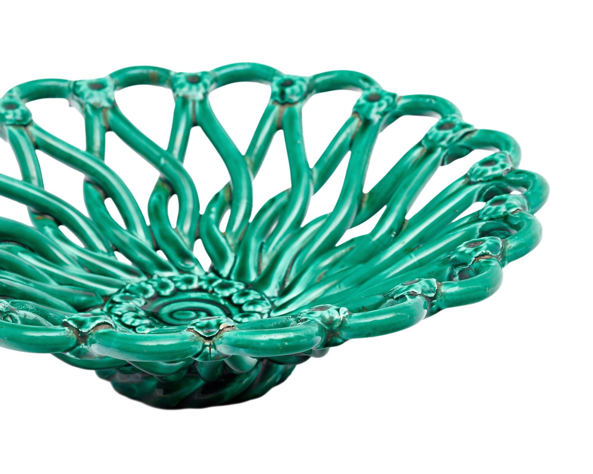 Ceramic bowl from Vallauris, France in a beautiful teal glaze. The hand braided ceramic technique is typical of the work produced in this famous town. This bowl is in very nice vintage condition with only minor surface wear consistent with age and