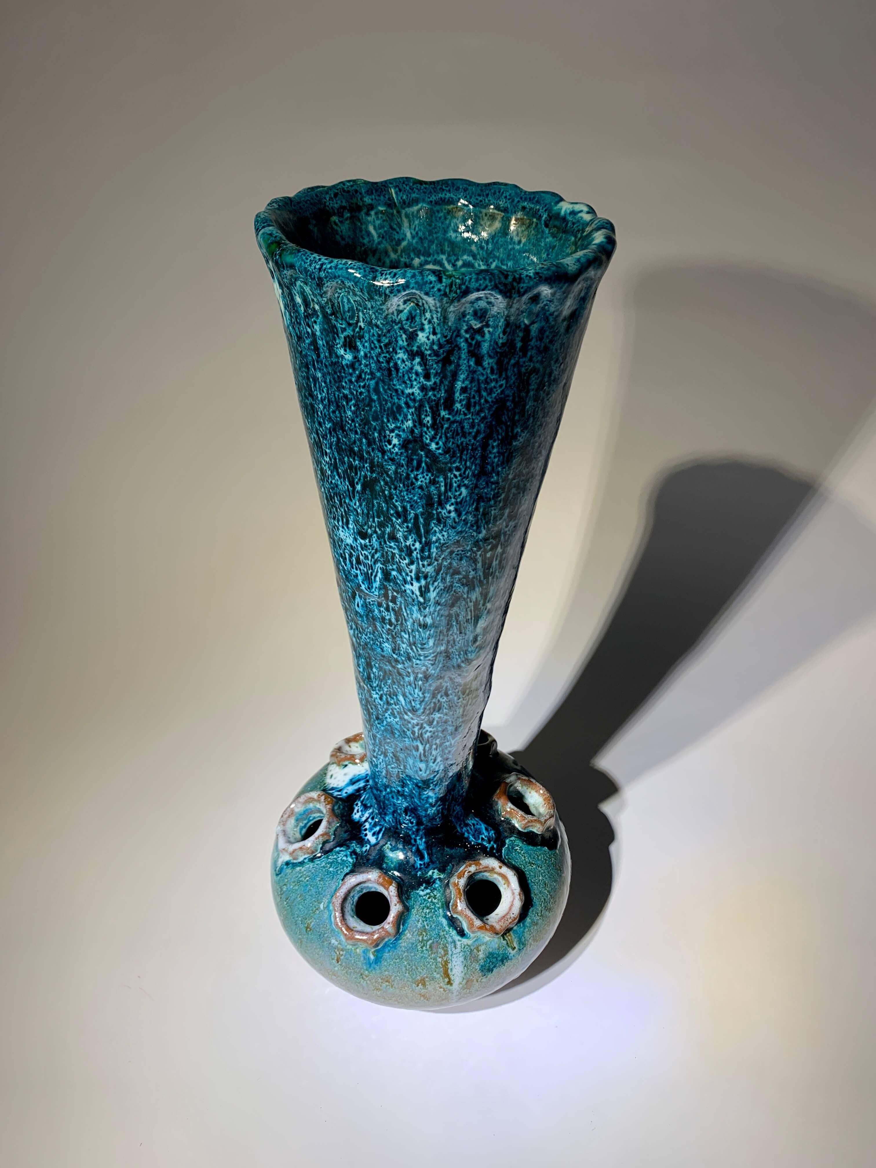 Very large original French vase featuring two openings: a wide one at the top and several smaller holes at the base, specifically designed for individual flowers. 
It showcases a beautiful glaze in stunning shades of emerald blue-green, creating a