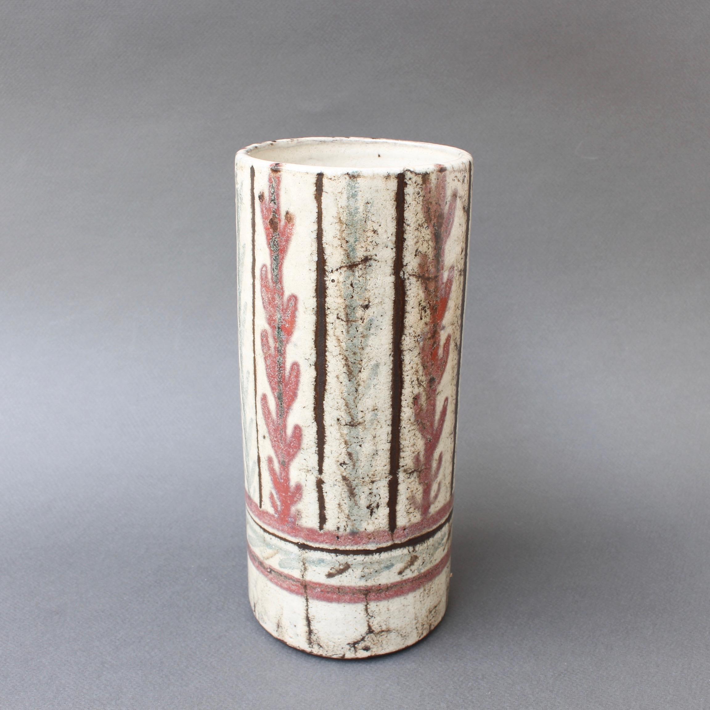 French ceramic vase by Gustave Reynaud, Le Mûrier (circa 1950s). This delightful flower vase is a work of art in the trademark style of Gustave Reynaud. On the rustic exterior you will find charming foliage with baby blue and mulberry coloured