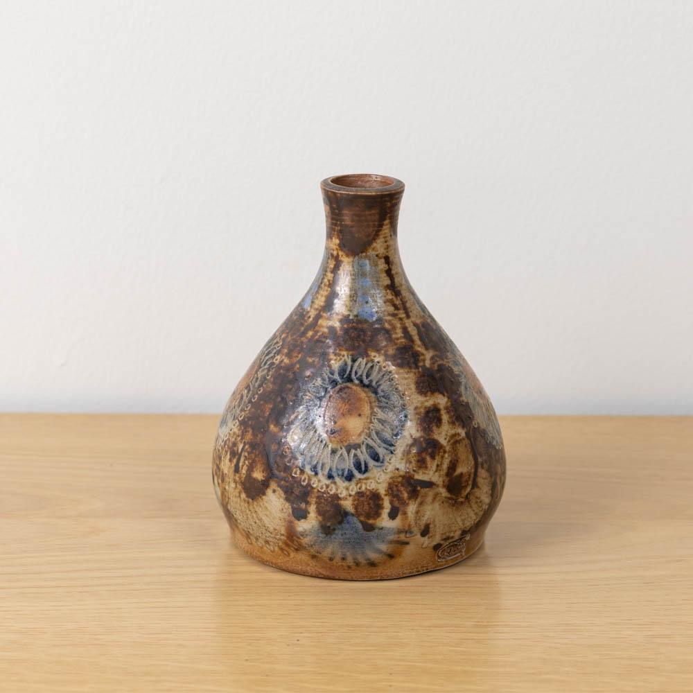 Unique ceramic bud vase made by French artist Jean-Claude Courjault, 1960's. Beautiful brown and blue painted floral motif with etched details. Excellent condition and signed on underside.