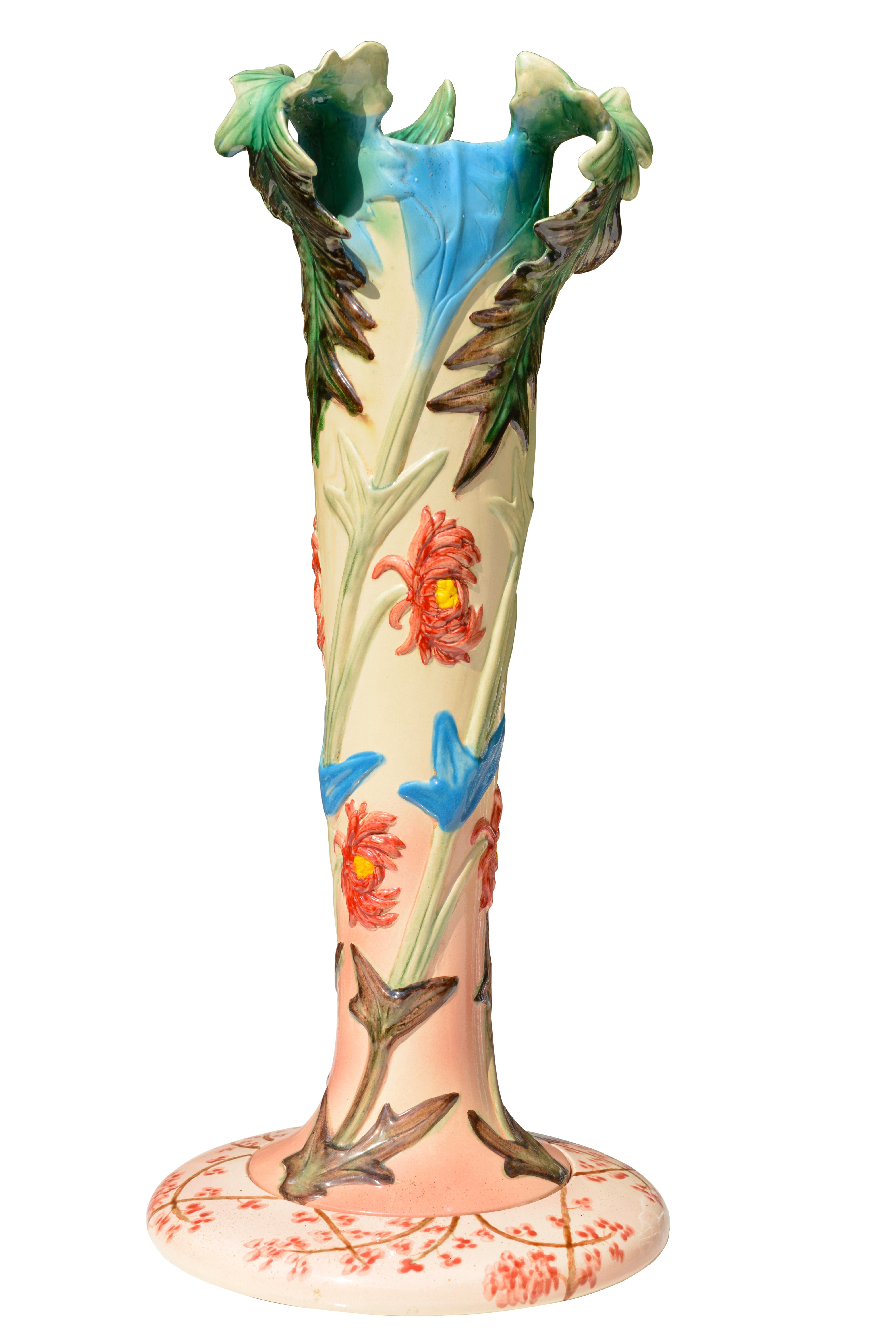 Unique romantic flower vase, made in France, circa 1900 in the Napoleon III style spirit. Tall and thin on a wide and stabile round base. Elegant green and brown acanthus leaves adorn the top. On the body are delicate chrysanthemum flowers in coral