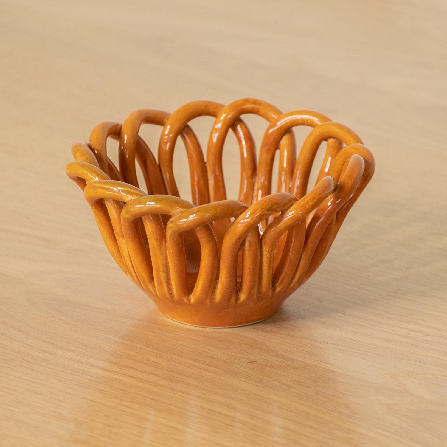 Vintage ceramic bowl with woven loop detail from Vallauris, France. Beautiful rich burnt orange glaze. Perfect as a decorative object or catch-all.