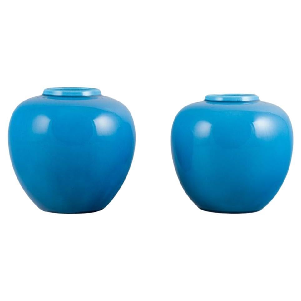French ceramicist, a pair of ceramic vases in turquoise glaze. Mid-20th century. For Sale