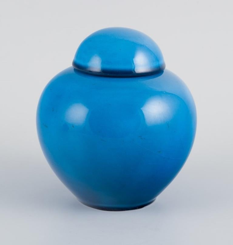 Modern French ceramicist, a pair of lidded jars in turquoise glaze. Mid-20th century. For Sale