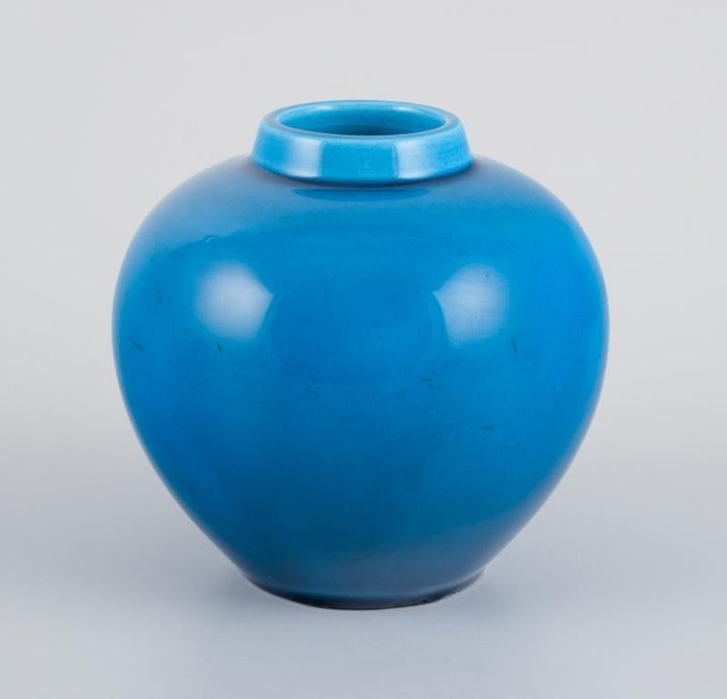 Glazed French ceramicist, a pair of lidded jars in turquoise glaze. Mid-20th century. For Sale