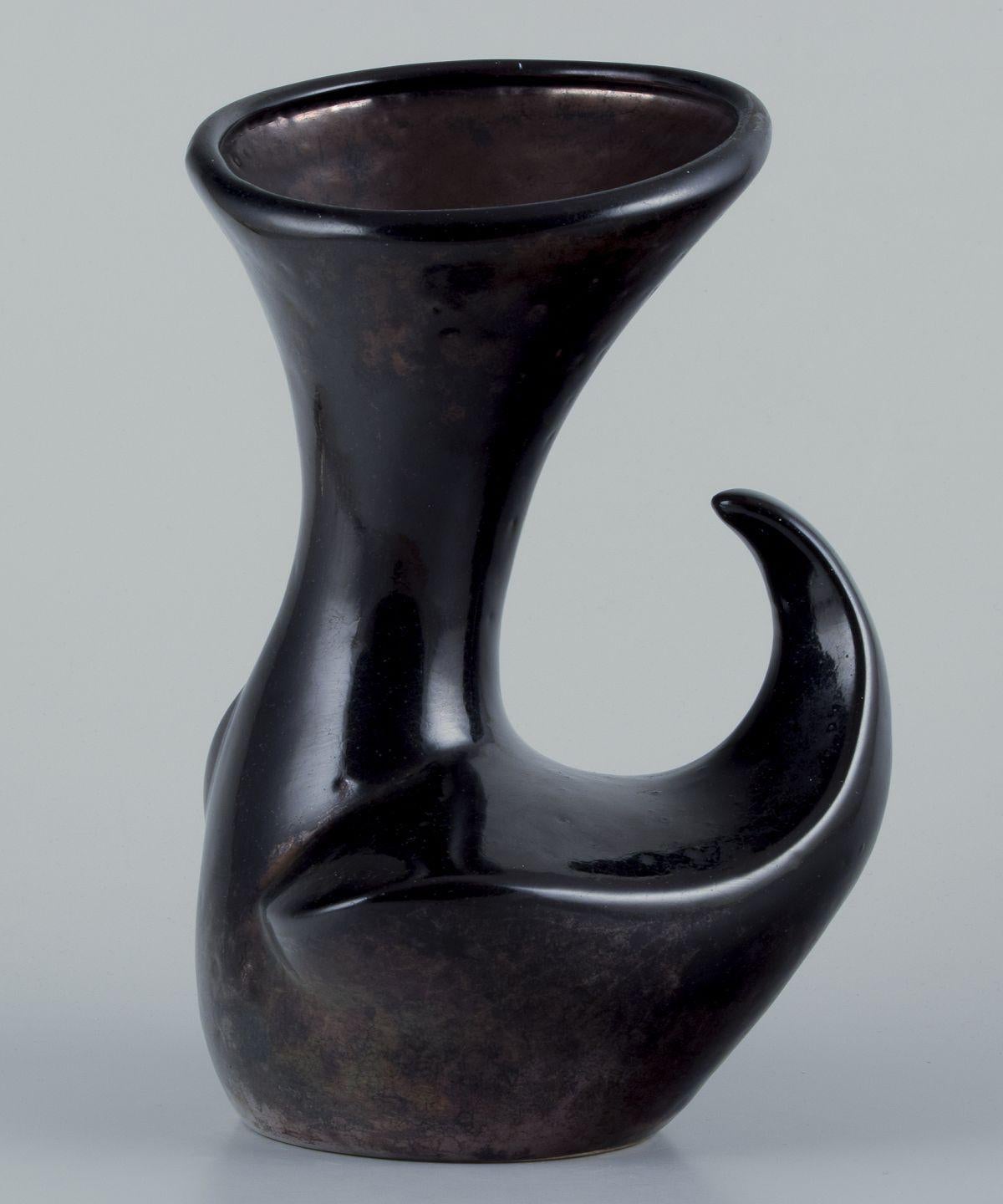 Pre-owned goods are exempt from import duties for U.S. customers. 
Therefore, no import tariffs will be applicable to your purchase.

French ceramicist.
Large ceramic vase. Organic shape.
Probably from Biot.
Black metallic lustre glaze. 
Circa