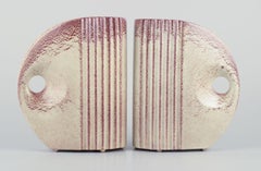 French ceramicist. Pair of Art Deco jug-shaped vases with handles.