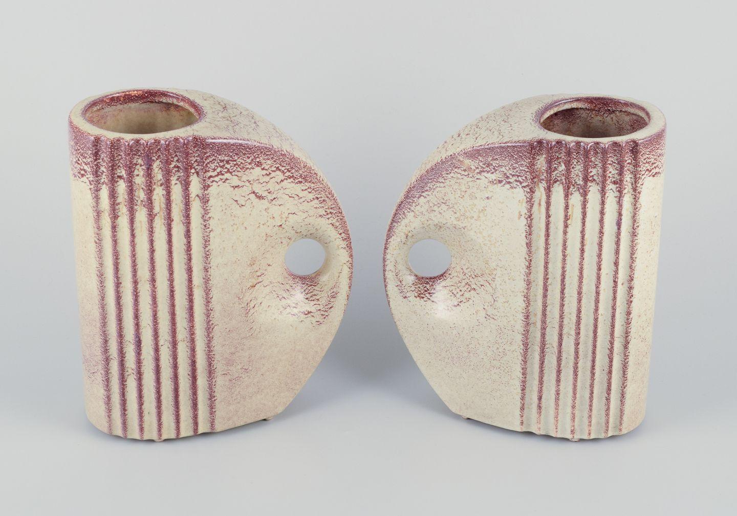 French ceramicist. Pair of Art Deco jug-shaped vases with handles.