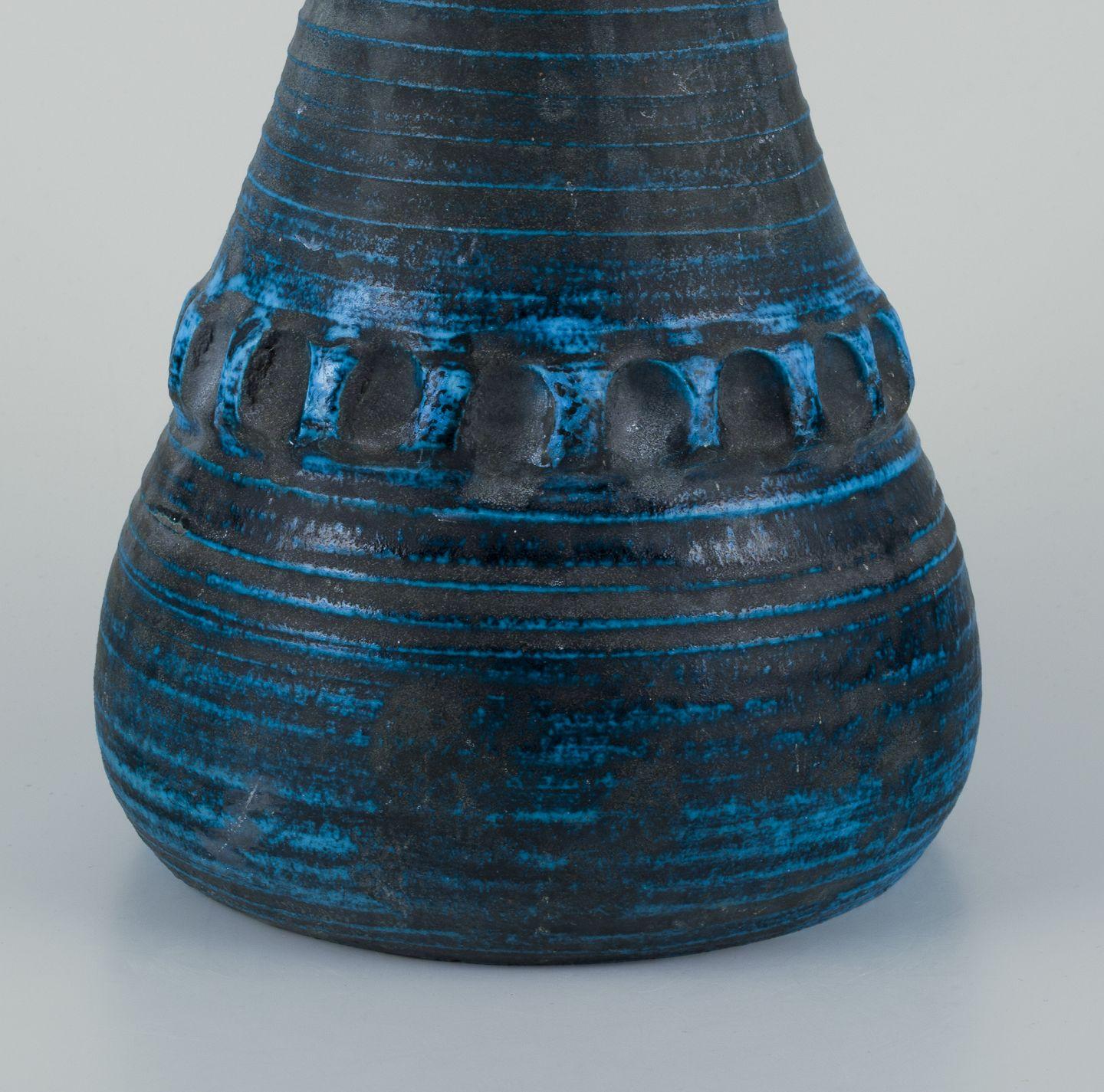 Pre-owned goods are exempt from import duties for U.S. customers. 
Therefore, no import tariffs will be applicable to your purchase.

French ceramicist. Unique ceramic floor vase.
Modernist style. Azure glaze. Narrow neck.
Decoration in