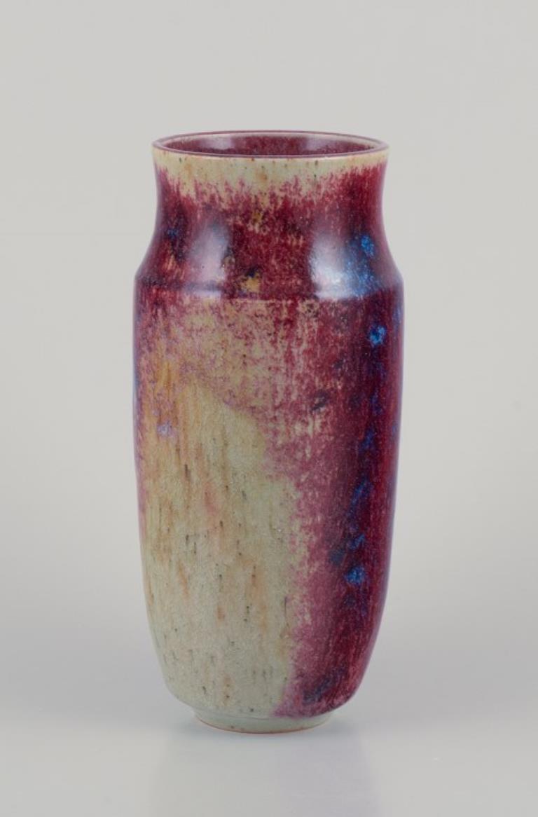 French ceramicist.
Unique ceramic vase.
Glaze in shades of blue-violet.
Mid-20th century.
Perfect condition with natural craquelure.
Indistinctly signed.
Dimensions: H 20.5 x D 8.0 cm.