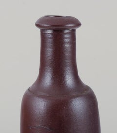 French ceramicist. Unique ceramic vase. Slender form. Brown glaze. Mid-20th C.