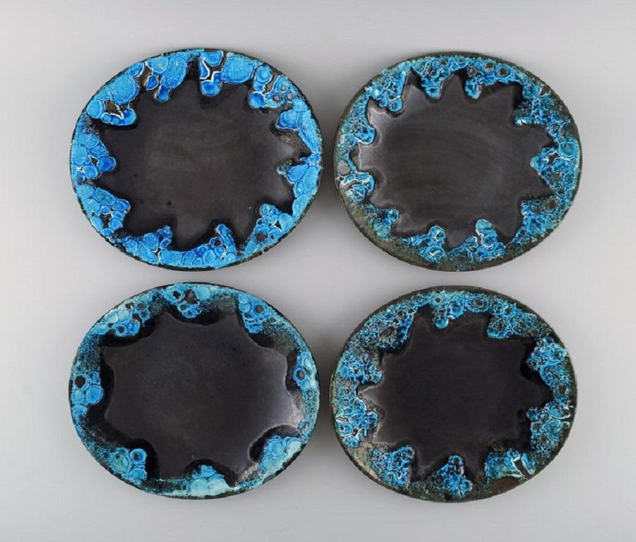 French ceramist. 24 dinner plates in glazed stoneware. 
Beautiful glaze in azure shades. Unique, high-quality ceramics. Mid-20th century.
Measures: 25.5 x 22.5 cm.
In excellent condition.