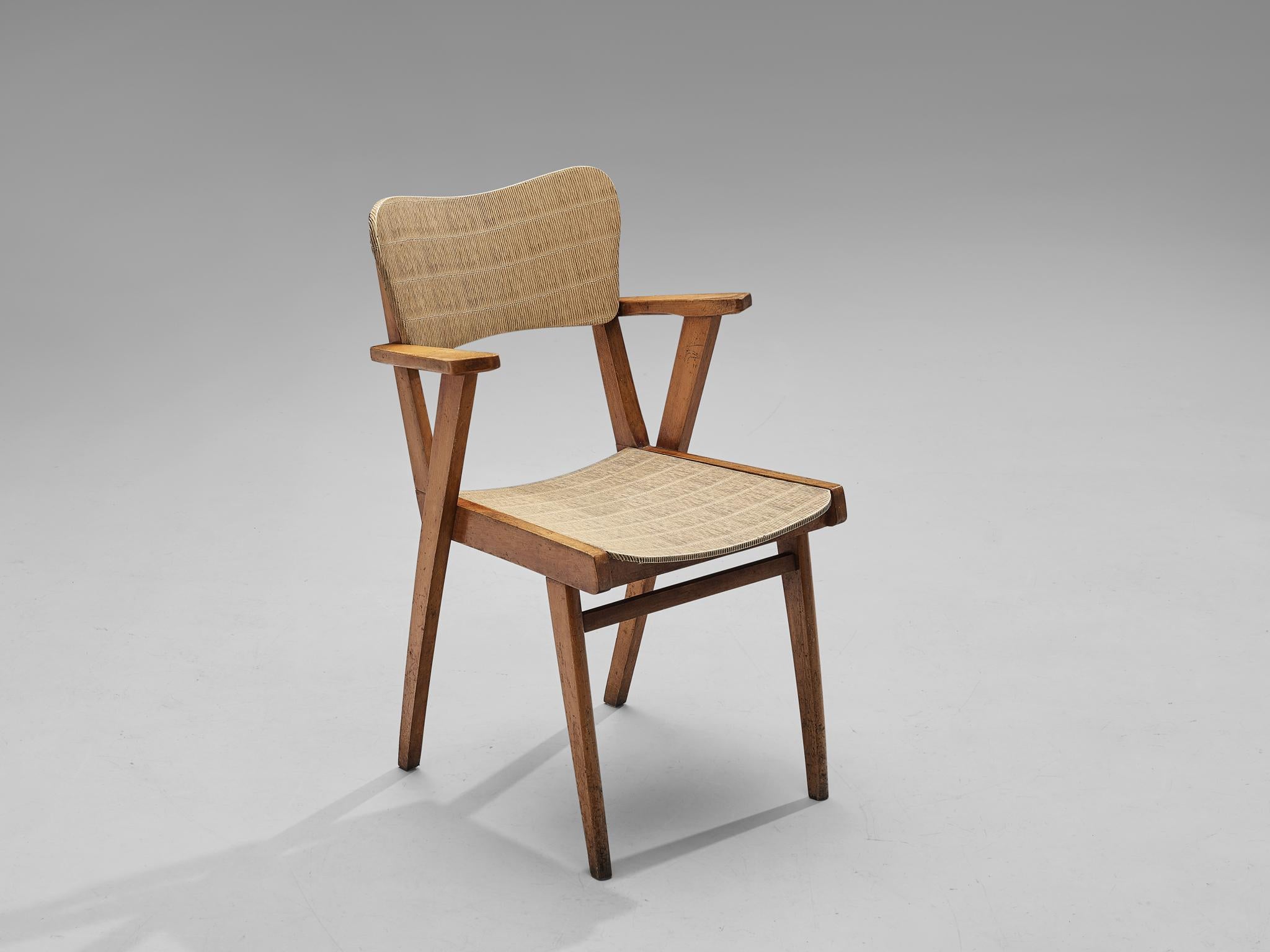 Side chair, beech, vinyl, France, 1960s 

This dining chair is characterized by a sculptural construction featuring sleek lines and geometrical shapes. The seating area and backrest are executed in a peculiar material called vinyl that replicates