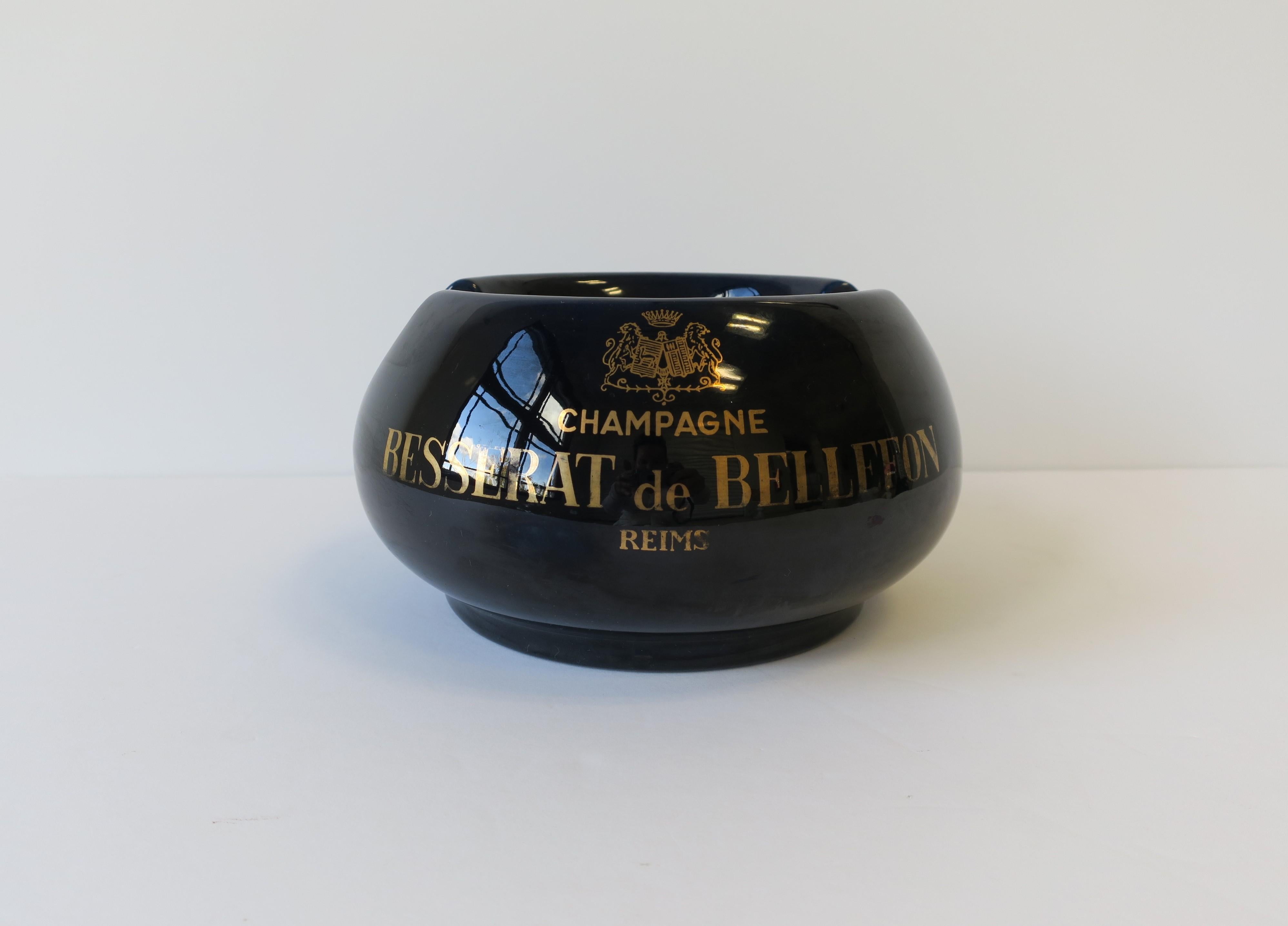 A great, relatively large, dark blue and gold ceramic cigar ashtray made for French Champagne house 'Besserat de Bellefon', made in France, circa 20th century. Piece reads, on both sides: 'Champagne', 'Besserat de Bellefon', 'Reims'. Marked on