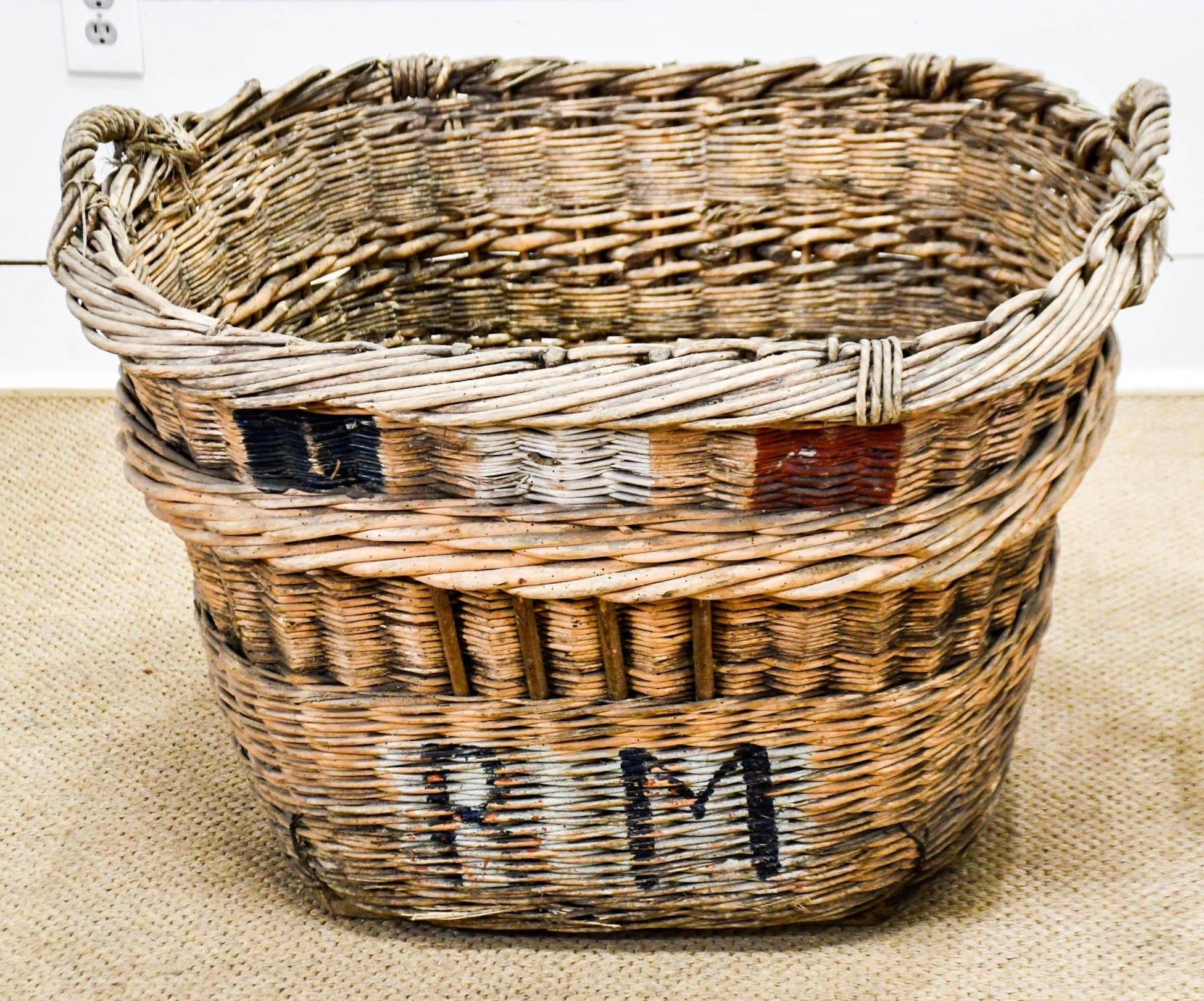 Wonderful large champagne grape gathering baskets can be used for a multiple of purposes -- laundry, toys, firewood, or just plain old decoration.
 