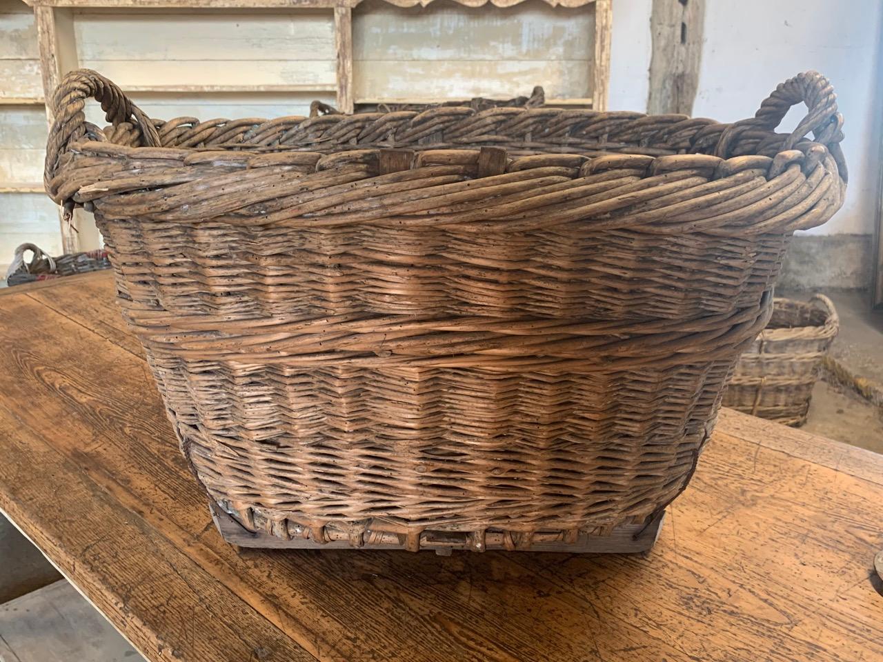 A nice early 20th century grape harvesting basket from the Champagne region of France. These were used to harvest the grapes in the vineyards and still have the painted markings of the vineyard owner, circa 1900.
 