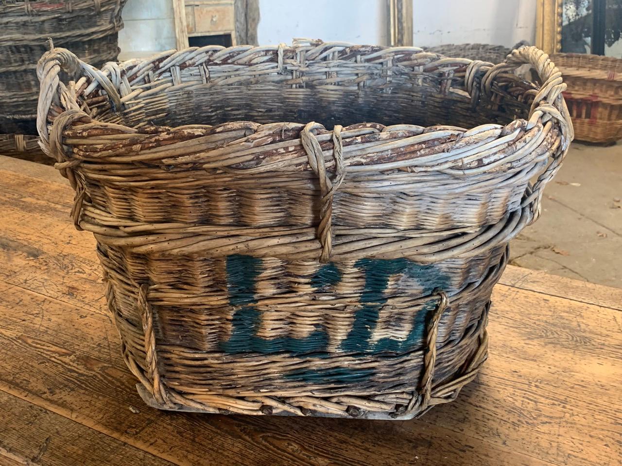 A nice early 20th century grape harvesting basket from the Champagne region of France. These were used in the vineyards to harvest the grapes and have the painted markings of the vineyard owner. circa 1900.
 