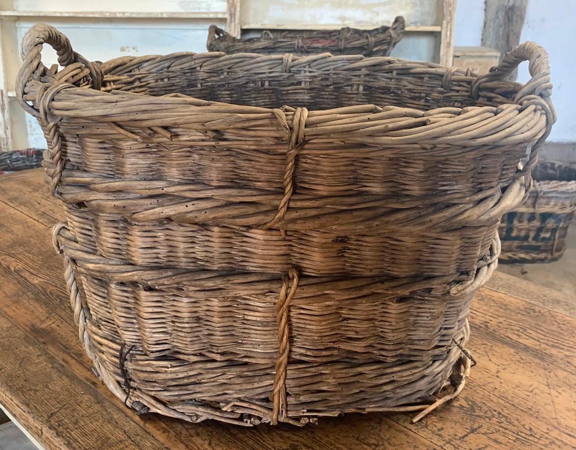 A nice early 20th century grape harvesting basket from the Champagne region of France. These were used in the vineyards to harvest the grapes. circa 1900.
      