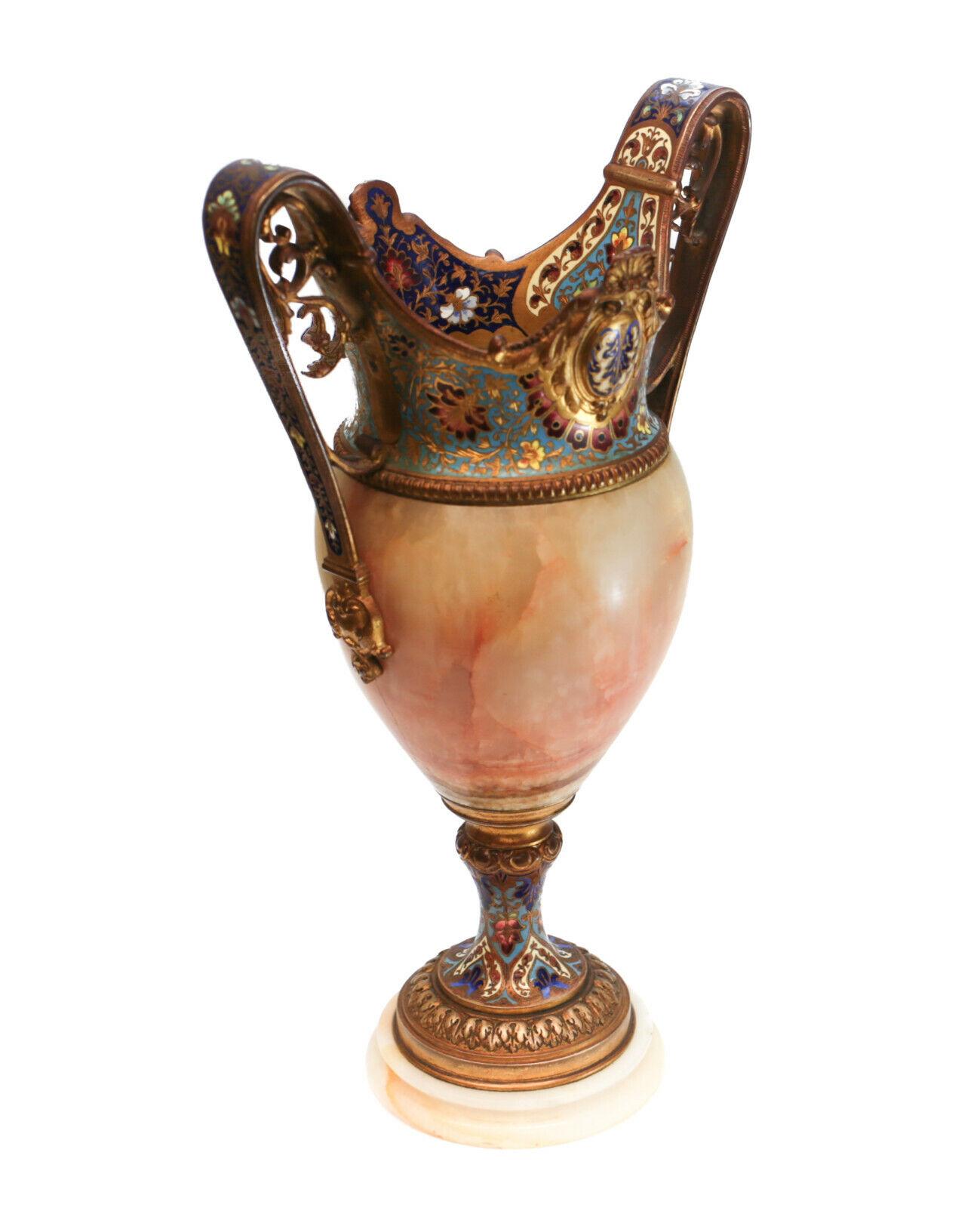 A Fine French champleve enamel and white onyx double-handled vase, 19th Century. Beautiful enamel florals throughout the gilt bronze with beaded accents. 

Additional information:
Style: French 
Age:19th Century
Type: Vases
Dimension: 7 inches