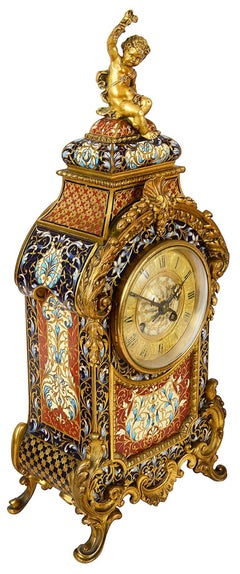 French Champleve enamel clock set, 19th Century.