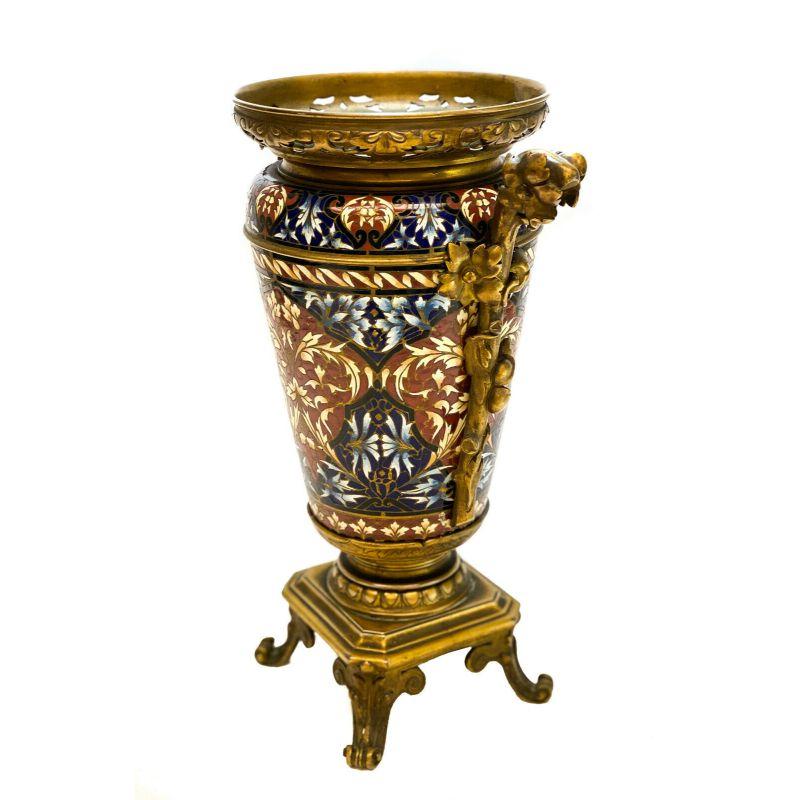 French Champleve Enamel gilt bronze Mounted vase, Barbedienne quality, 19th century

Blue and red champleve enamel leaves throughout. Gilt bronze mounts to the rim, handles, and feet. Barbedienne Quality.

Additional information:
Primary
