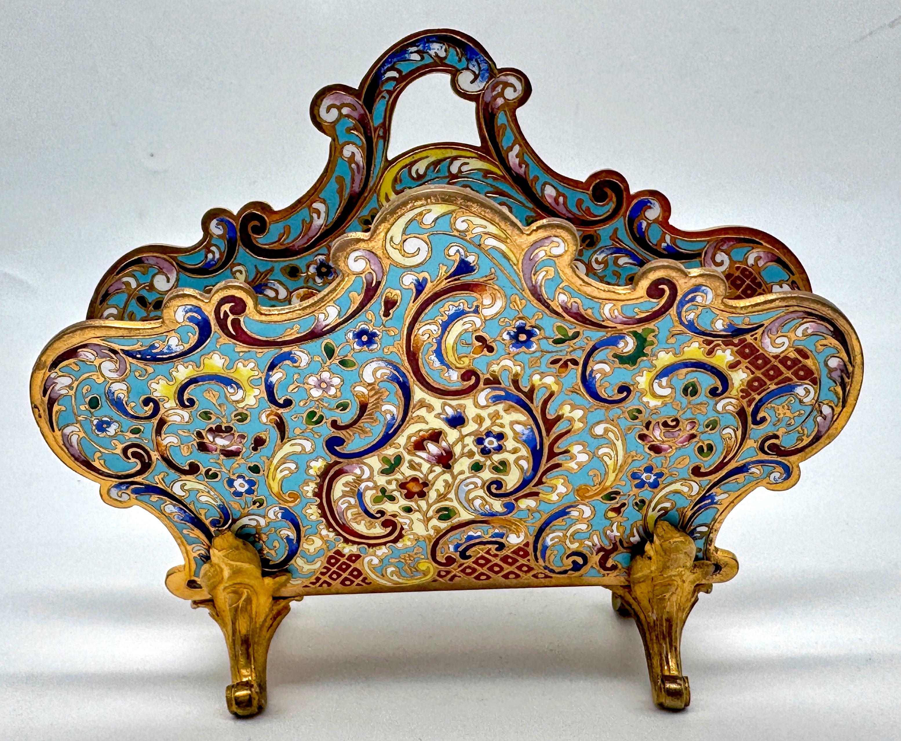 French Champlevé Enamel & Ormolu Letter Rack, Late 19th Century

A richly ornamented French champlevé enamel and gilt bronze letter rack, dating to the late 19th century. This jewel-like desk accessory exemplifies the refinement of Limoges enamel
