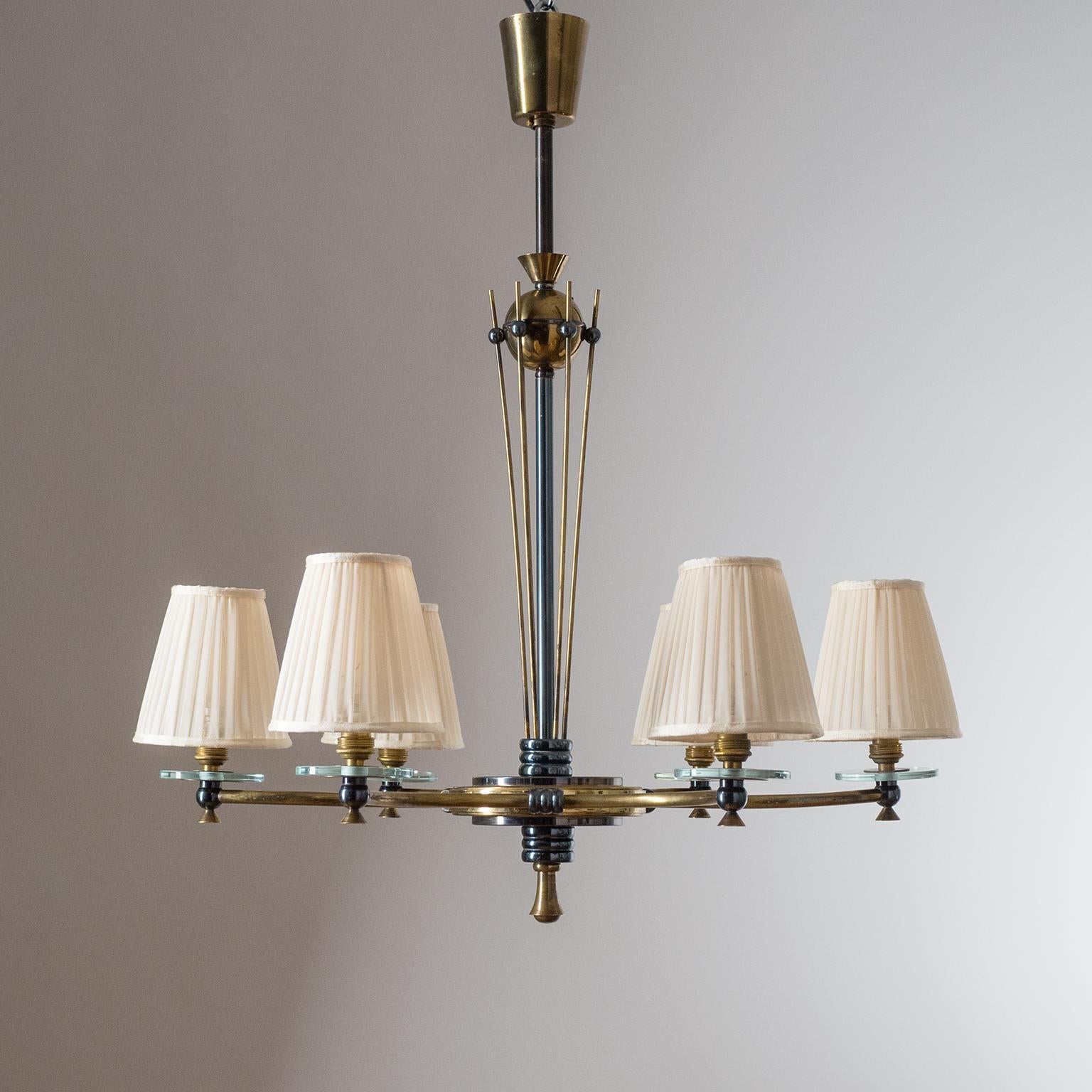 Rare French brass chandelier, 1940s-1950s. Very intricate and detailed hardware in alternating dark and light patinated brass with glass disc accents. Very nice original condition with some age-related patina on the brass. Brass and ceramic E14