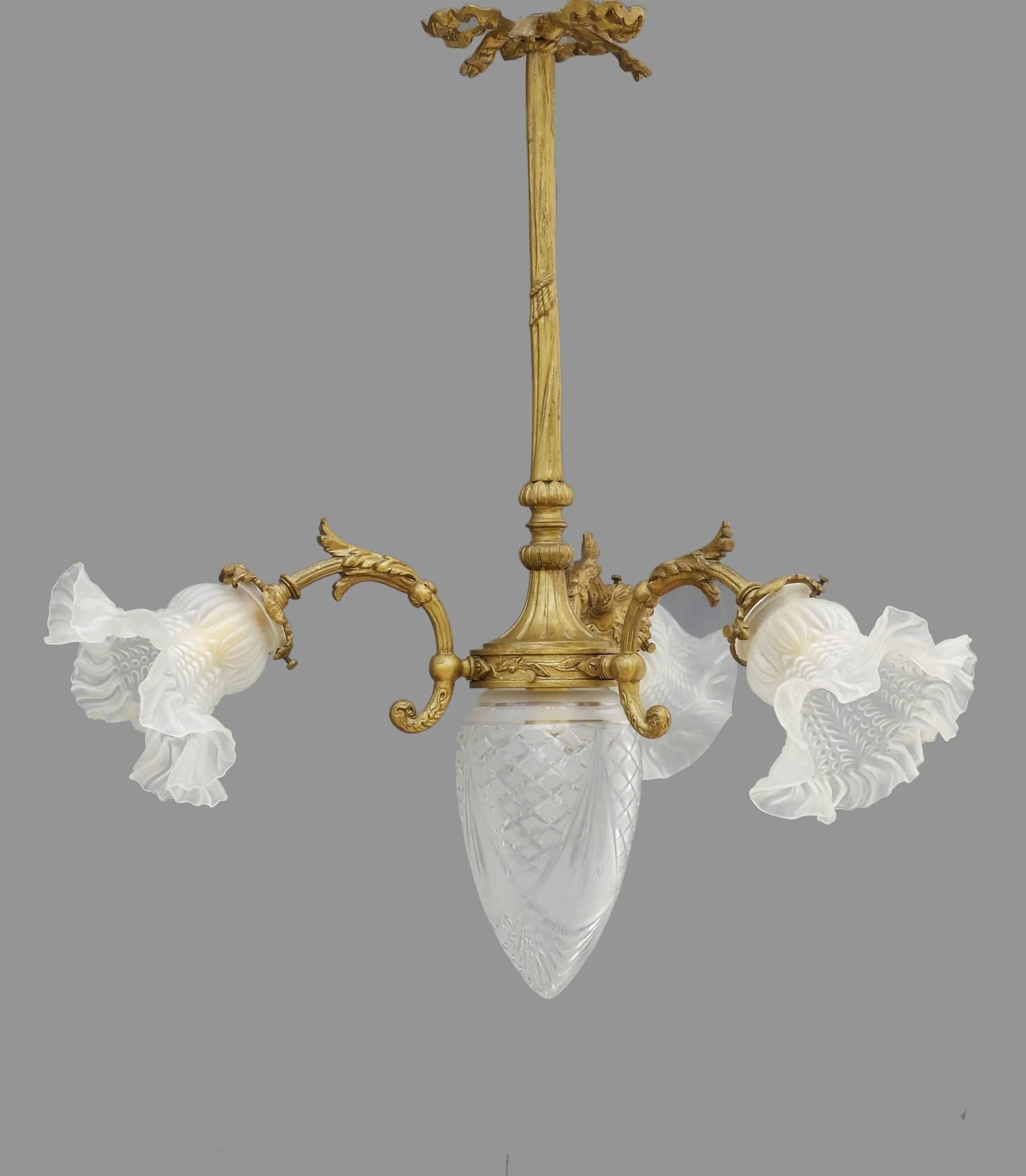 French chandelier, circa 1900, Belle Époque
Ornate gilt bronze light, three stems with frosted glass frilled tulip shades surrounding a central etched glass 'pomme de pin'
In good original condition with no losses to glass
Drop can be lengthened