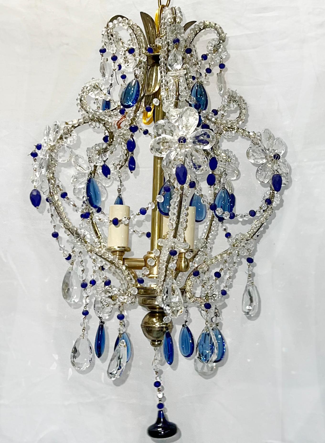 A circa 1920's French chandelier with blue pendants with 3 candelabra lights.

Measurements:
Drop: 23