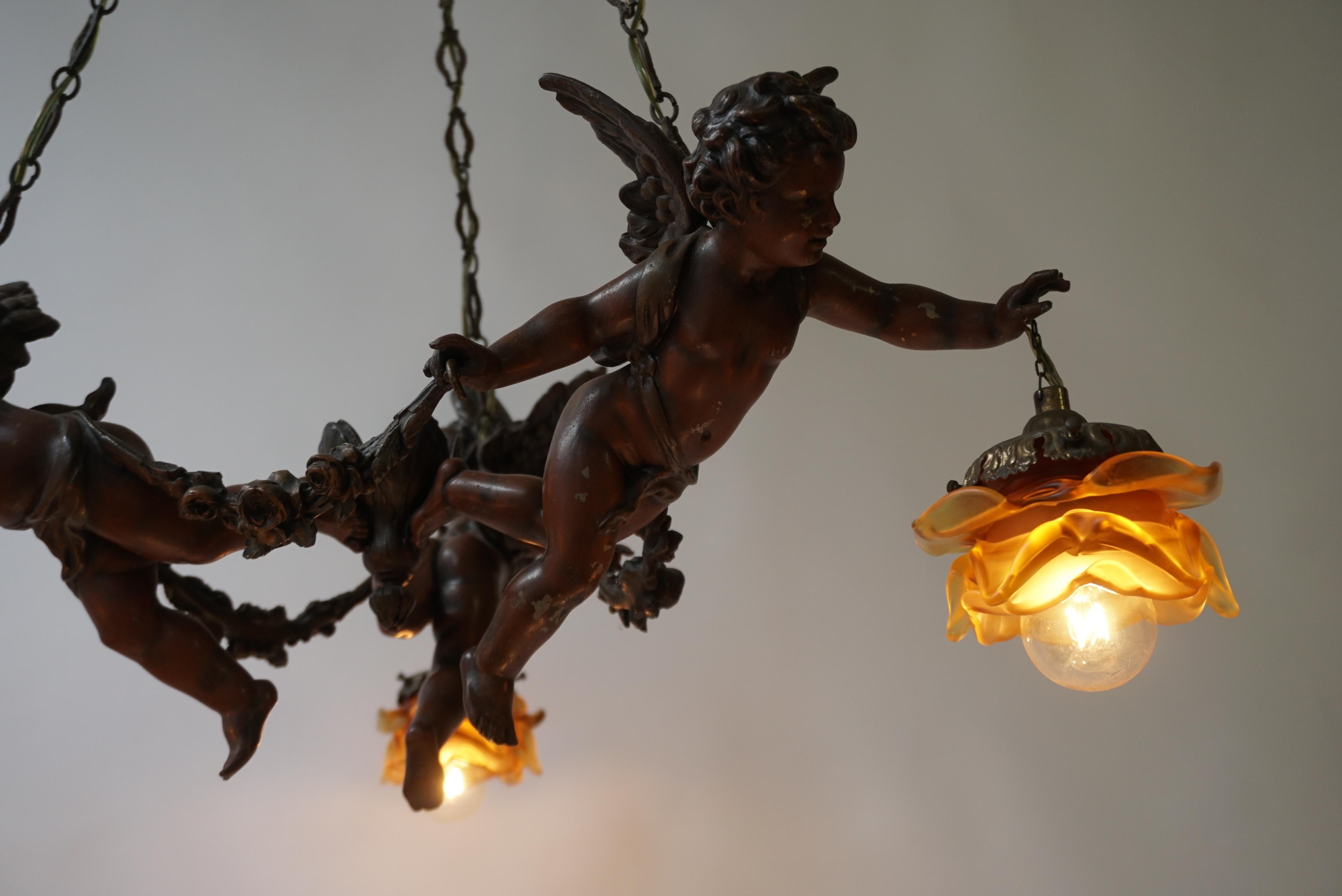French Chandelier with Three Cherubs Holding the Lights For Sale 7