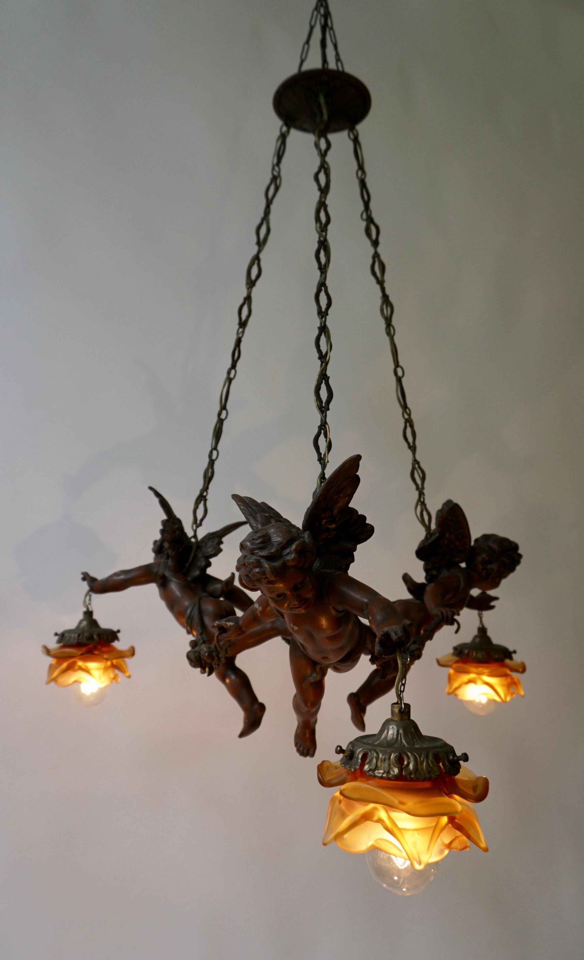 French Chandelier with Three Cherubs Holding the Lights For Sale 8