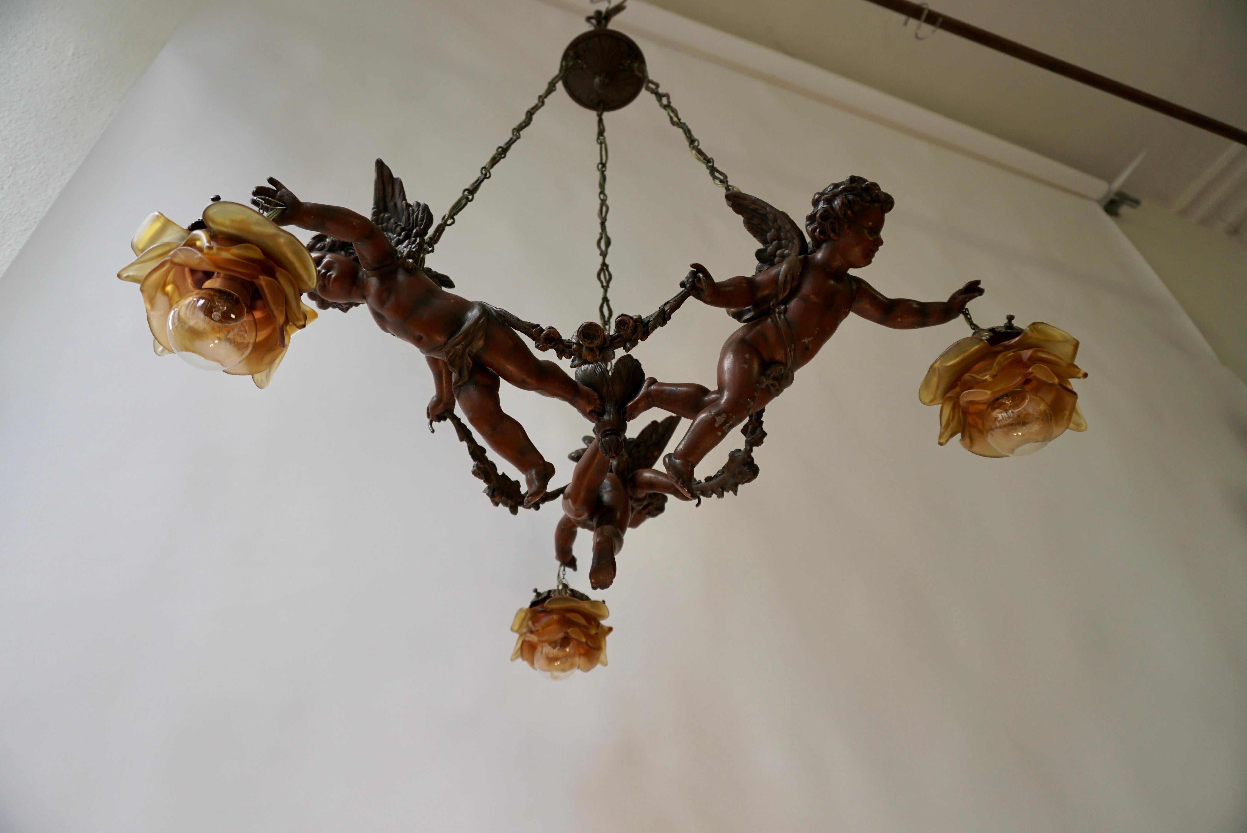 French Chandelier with Three Cherubs Holding the Lights For Sale 3