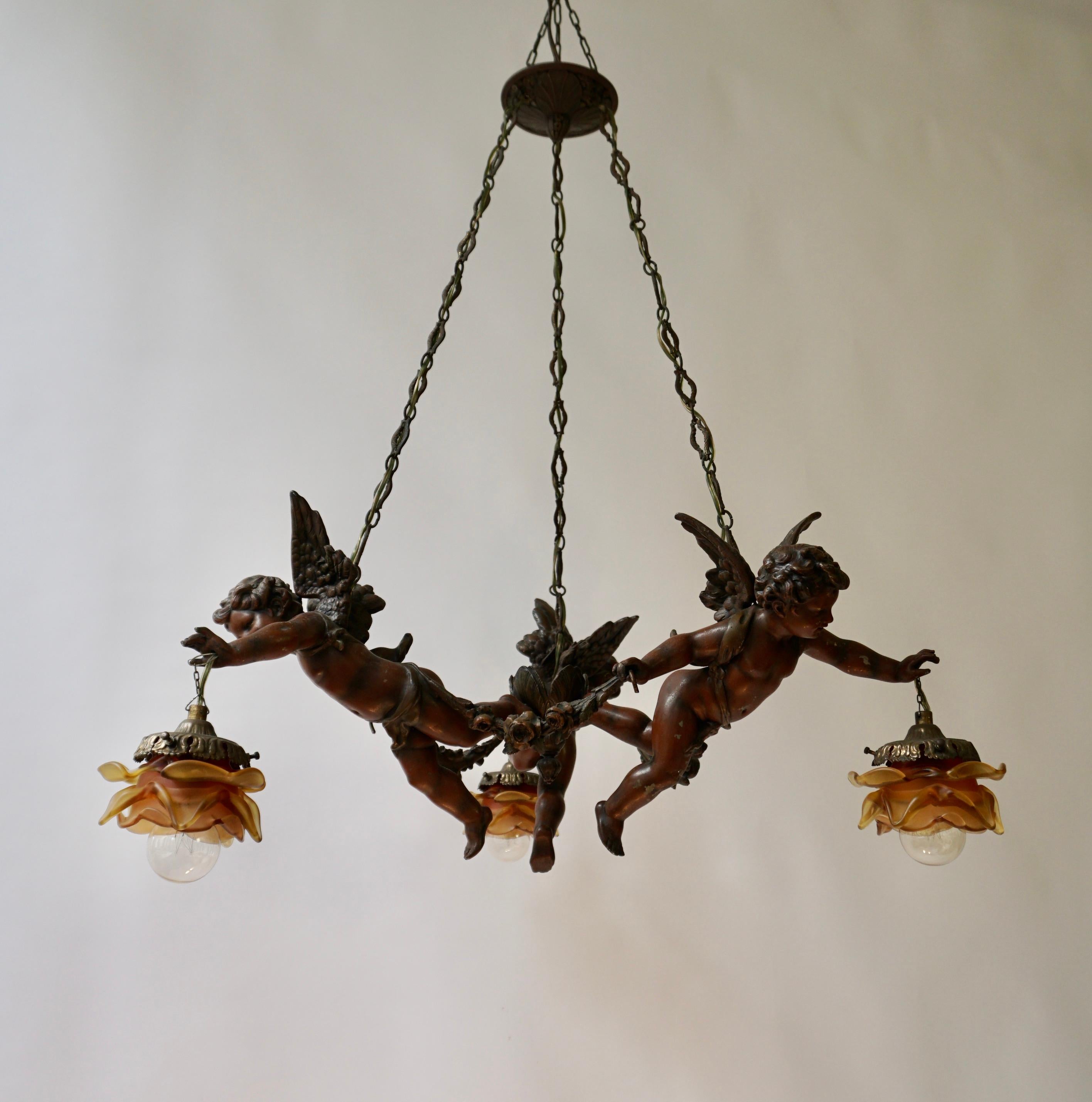 French Chandelier with Three Cherubs Holding the Lights For Sale 4