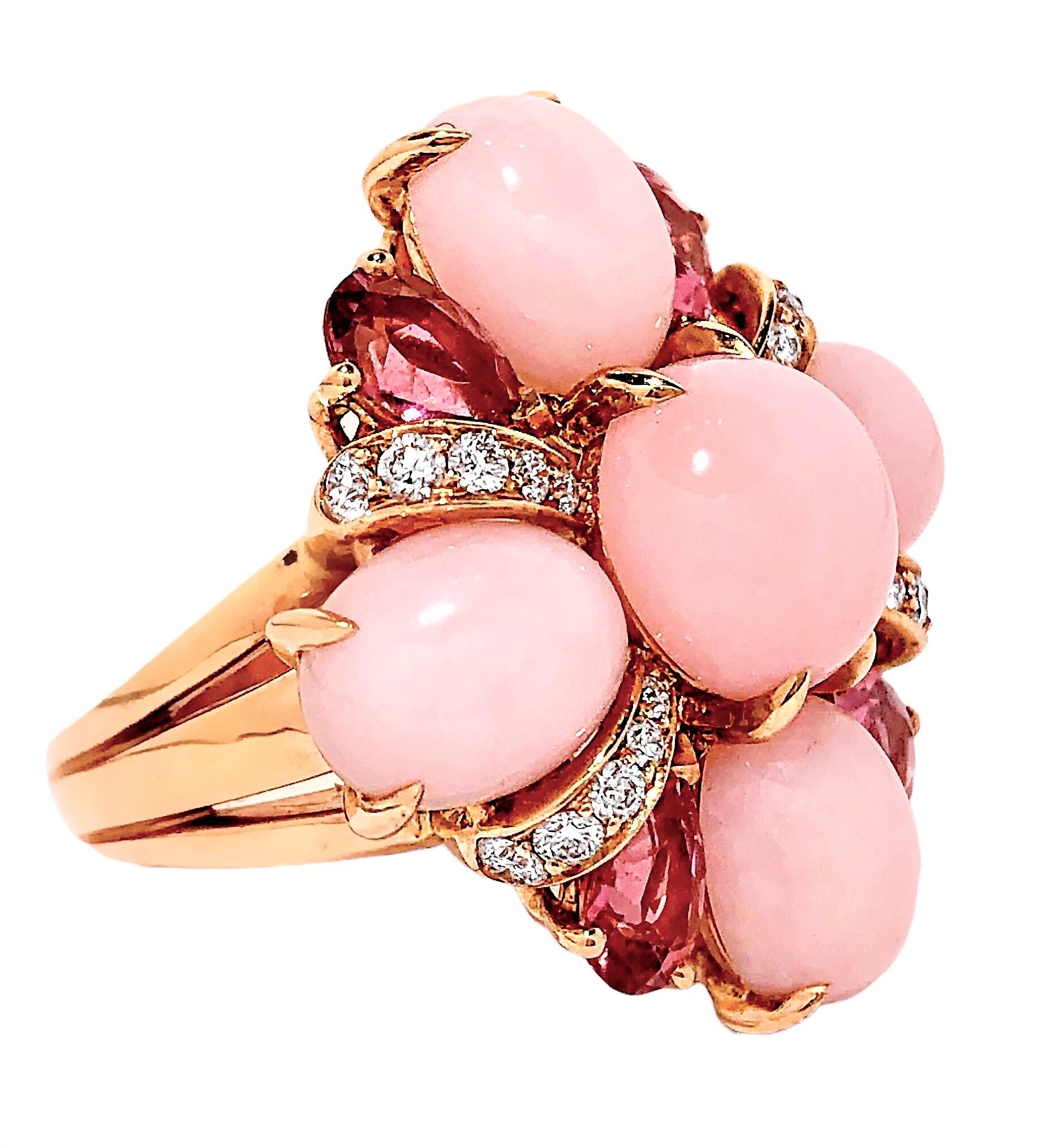 This unique 18K yellow gold creation from the esteemed fashion house of Chanel is absolutely the ultimate in feminine beauty. The very tasteful combination of the delicate, soft pink opal matrix cabochons, with the deep pink, faceted, pear shaped