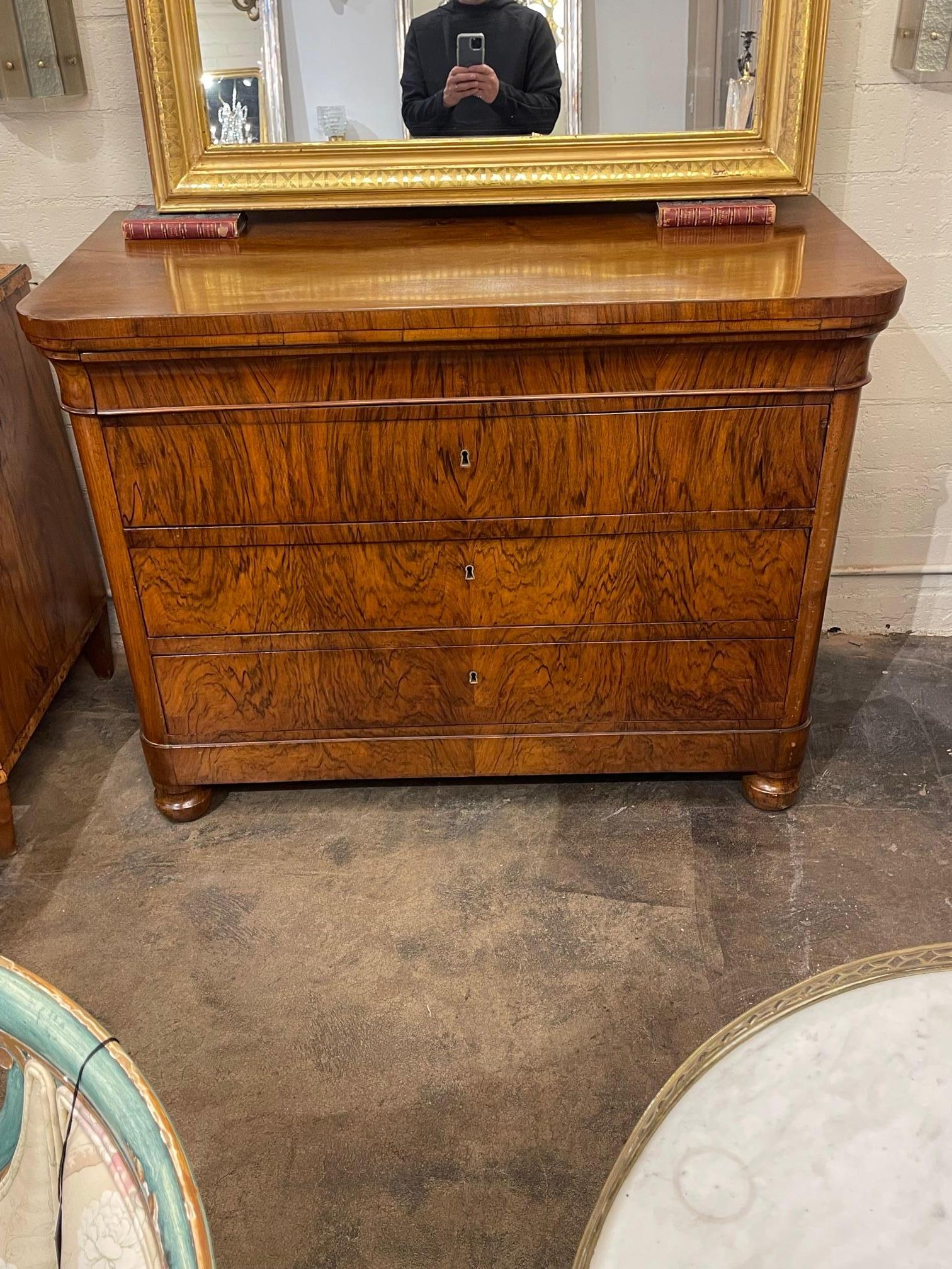 Handsome 19th century French Charles X black walnut commode, Circa 1850. This is a handsome piece with beautiful wood grain and polish.