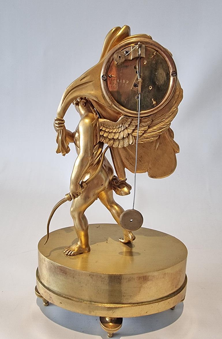 Early 19th Century French Charles X miniature mantel clock of Cupid carrying time For Sale