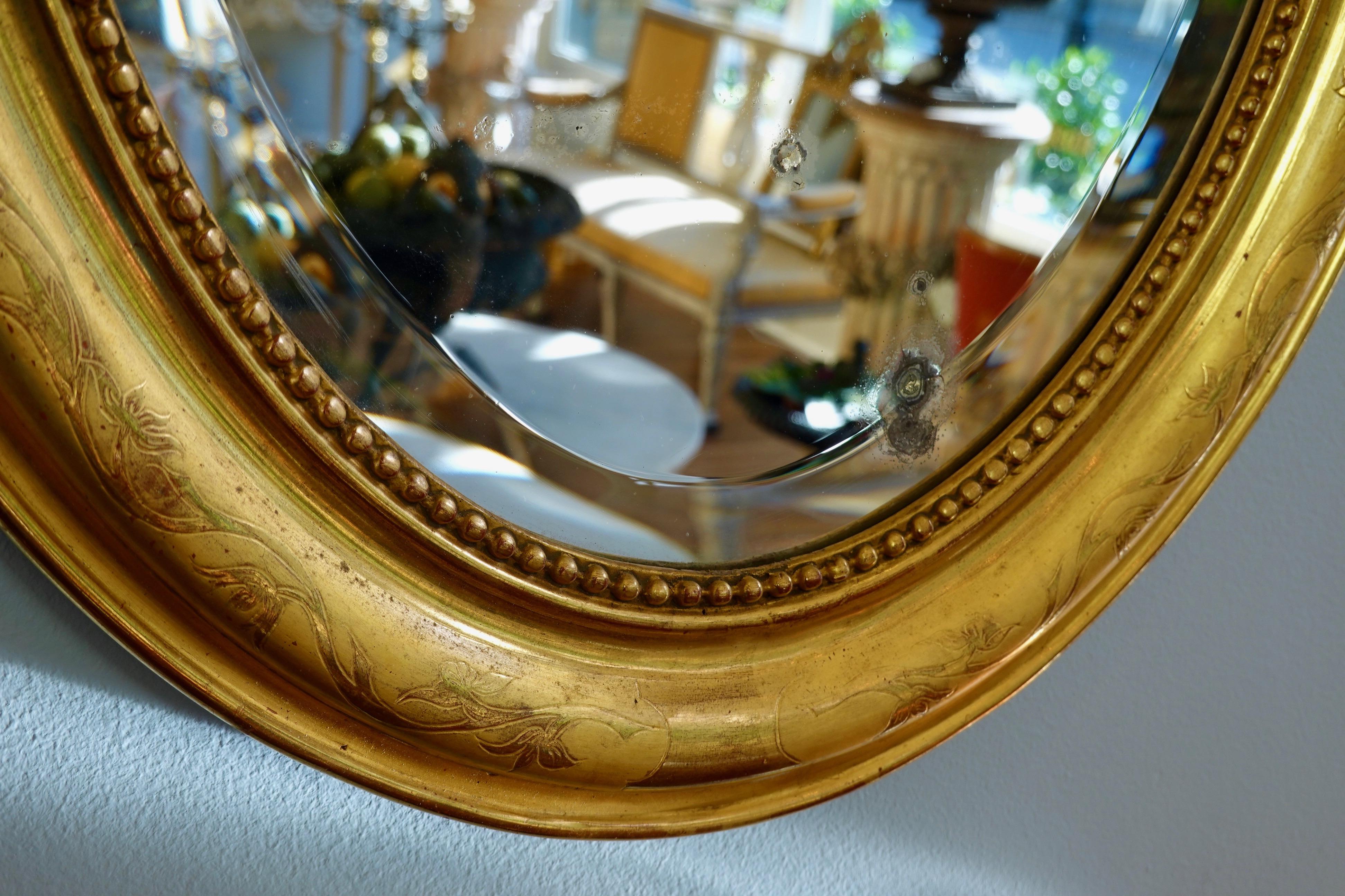 19th Century French Charles X Oval Mirror with Beveled Glass For Sale