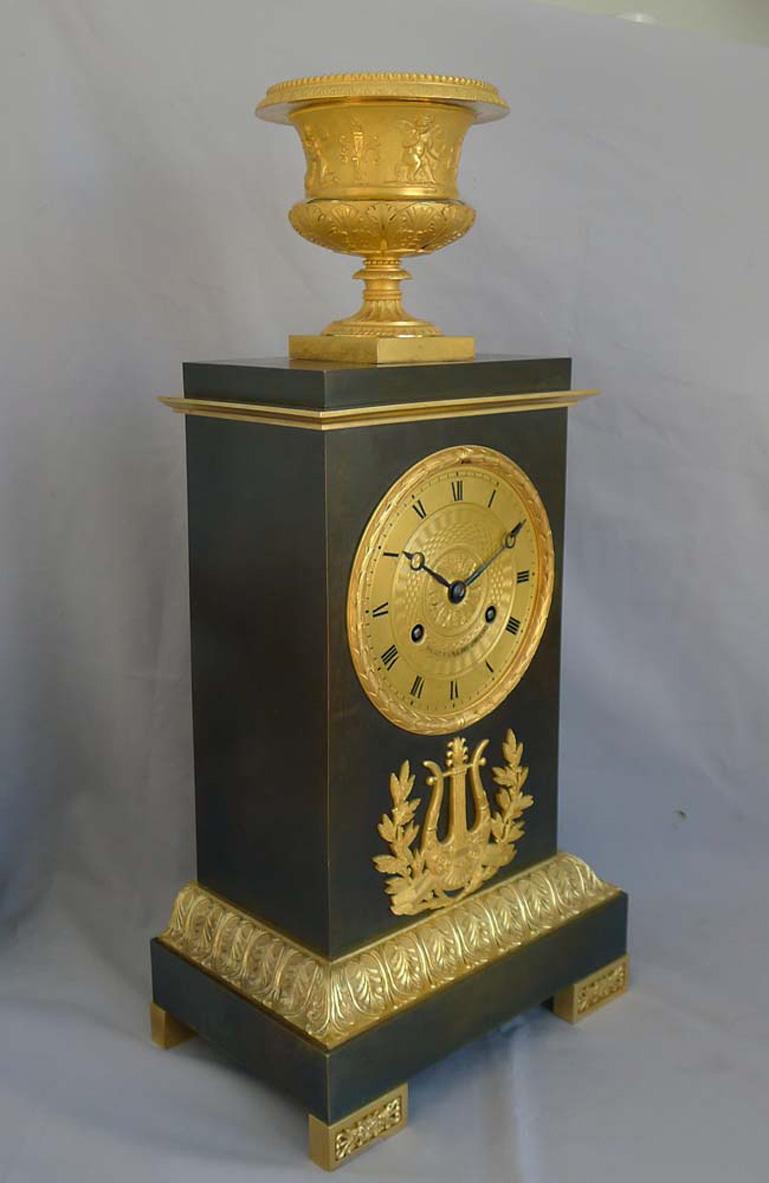 Early 19th Century French Charles X Period Mantel Clock in Ormolu and Patinated Bronze For Sale