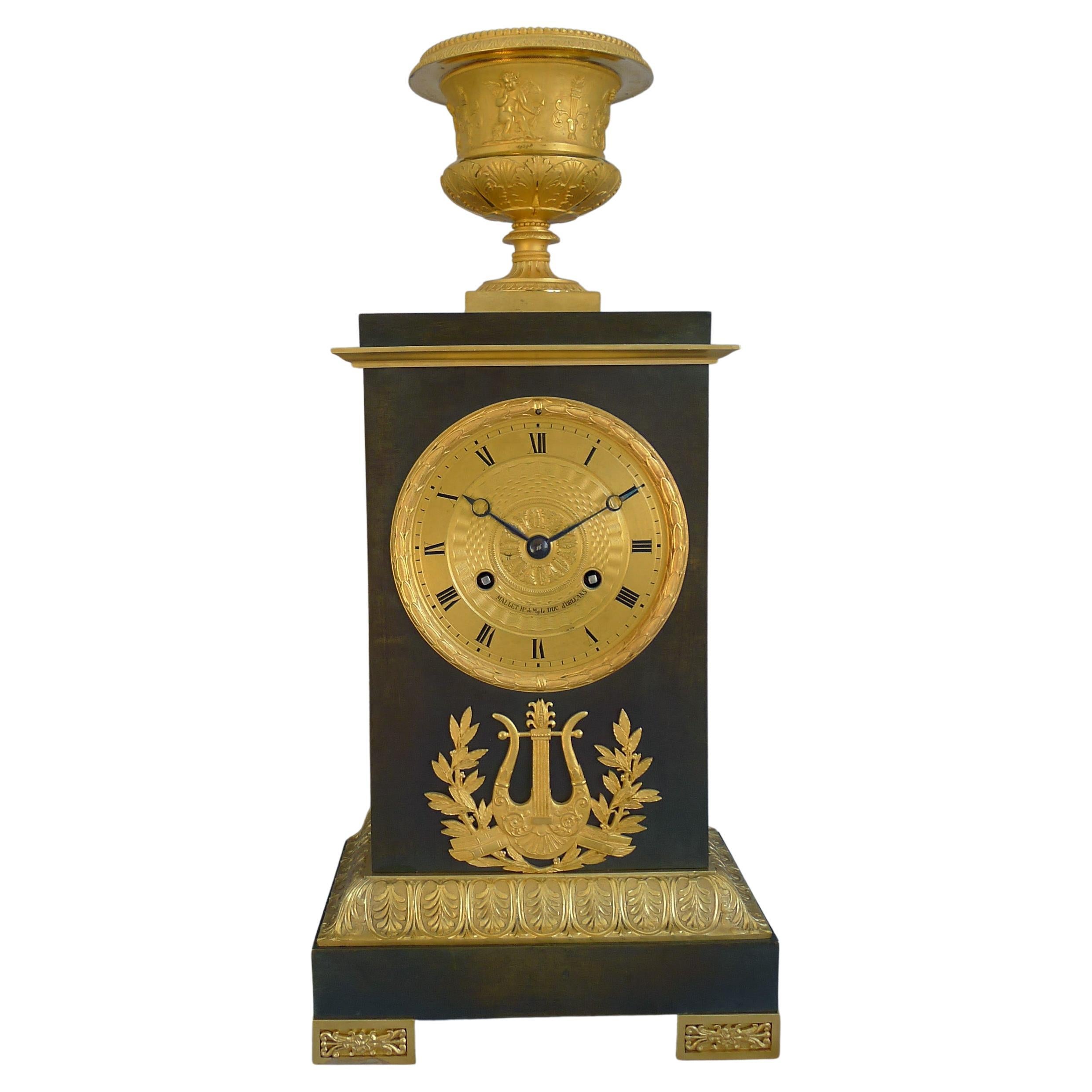 French Charles X Period Mantel Clock in Ormolu and Patinated Bronze For Sale