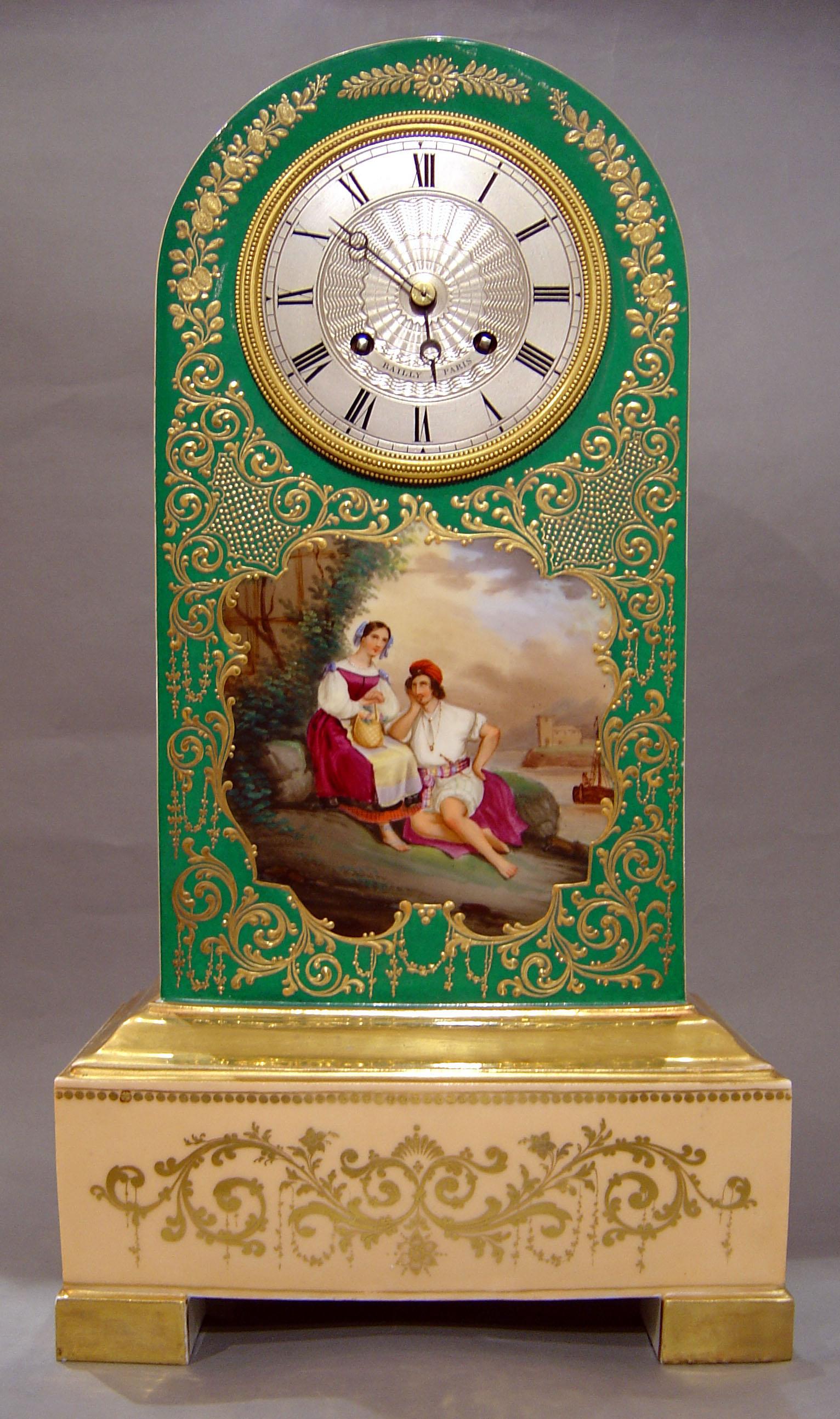 A most unusual Paris porcelain clock in the borne form from the Charles X period. Case probably by Jacob Petit with all over decoration in cream and fine giltwork. The plaque to the front with two figures in the foreground is a celebration of the